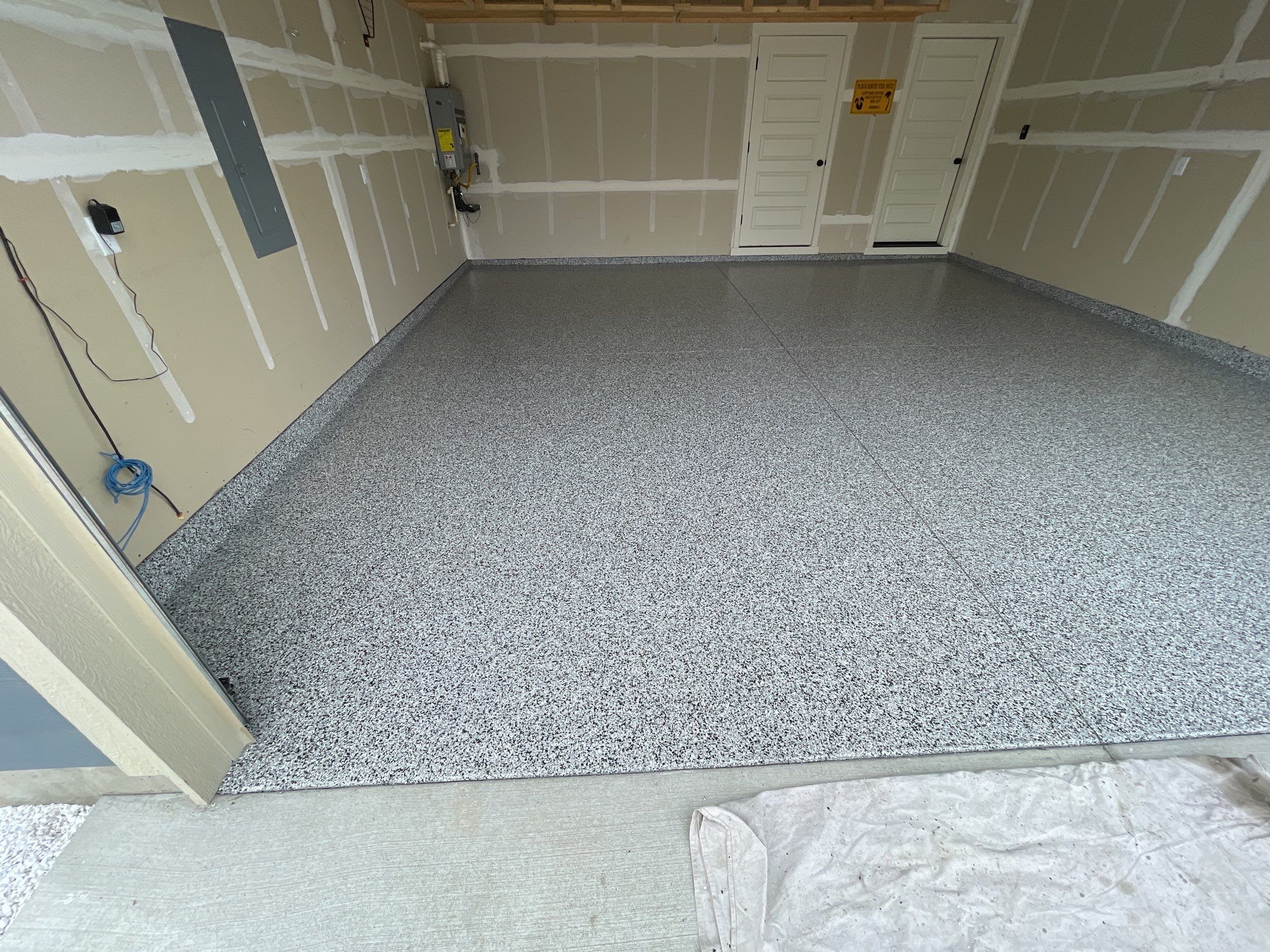 Garage Transformation using Domino by Croc Coatings, LLC