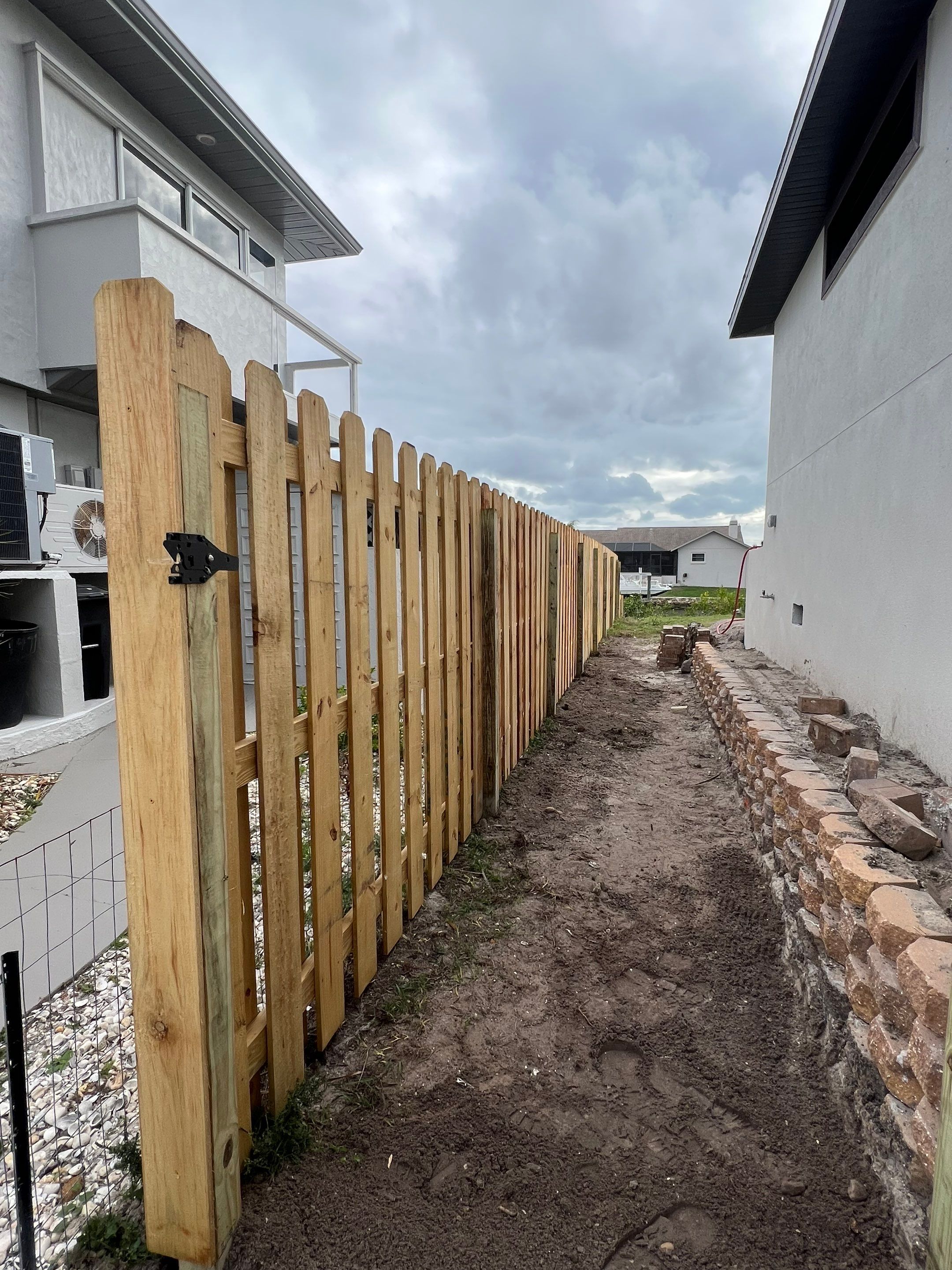Wood Fence Installation using 6Ft Tall Pressure Treated Wood Shadowbox Fence by Asap fence and gates, LLC