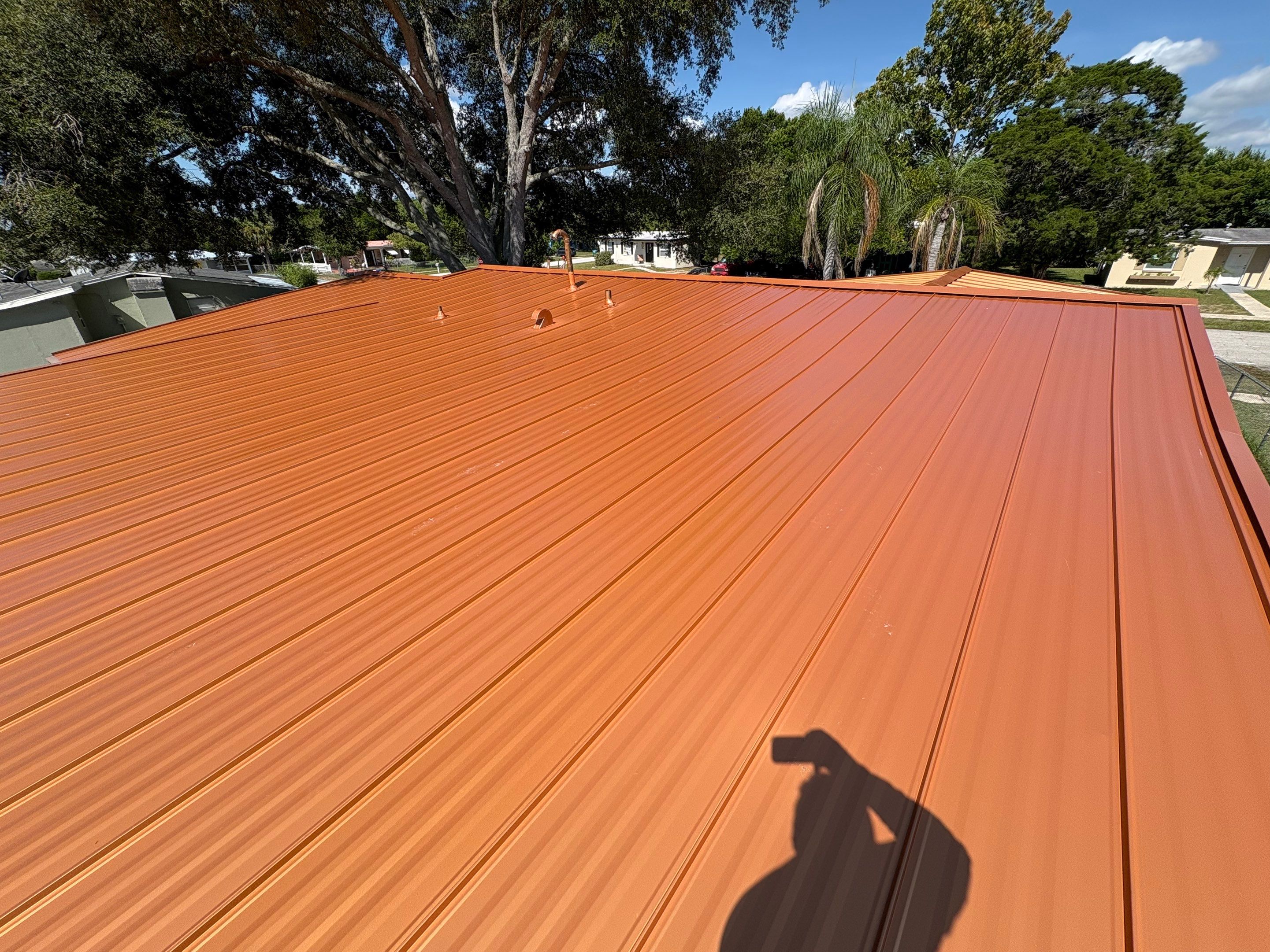 Standing Seam Metallic Copper Metal Roof Replacement in Deltona by Pinnacle Roofing Group