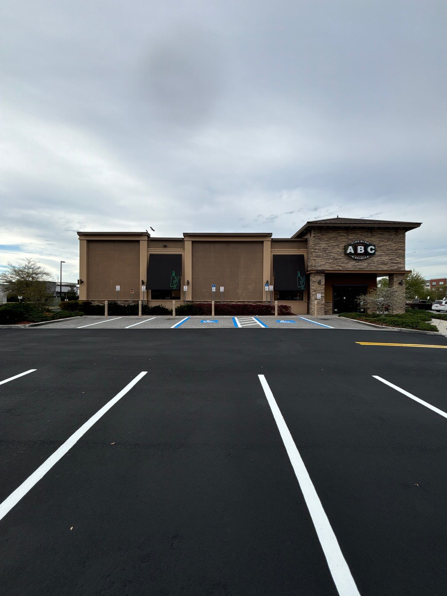 Brighter, Safer, Better: ABC Fine Wine & Spirits Parking Lot Makeover by Everline Coatings & Services - Southwest FL