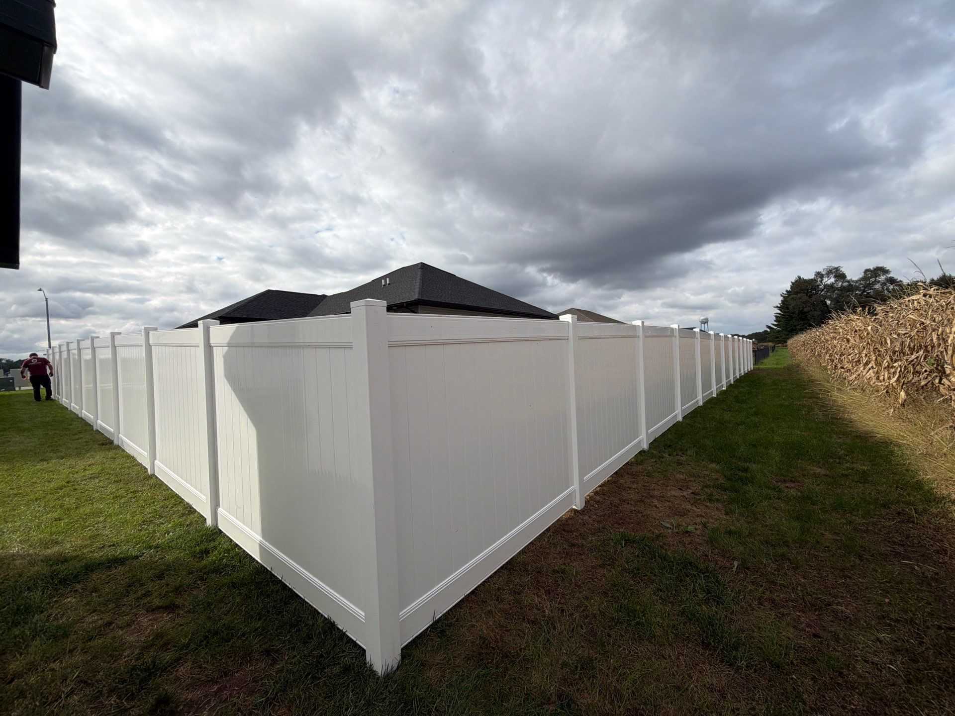 Residential White Vinyl Privacy Fence Installation in Janesville by Perfect Picket Fence and Stain