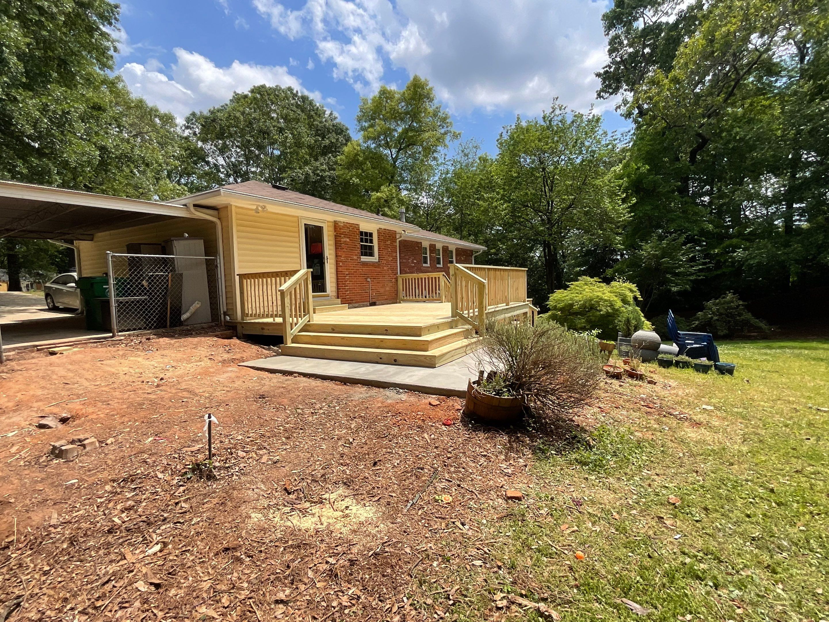 Custom Pressure-Treated Wood Deck and Railing Installation in Decatur by Swift Home Renovations