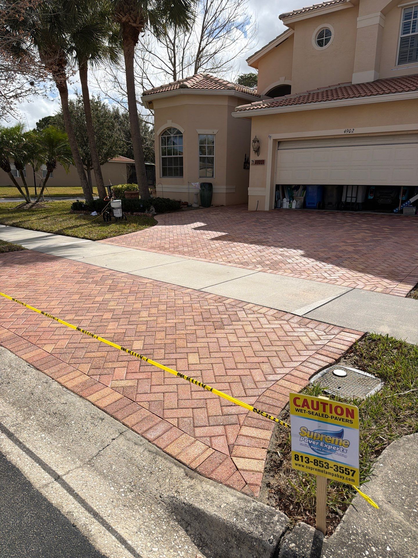 Paver Sealing for Herringbone Driveway and Screened Lanai in Valencia Lakes by Supreme Paver Experts
