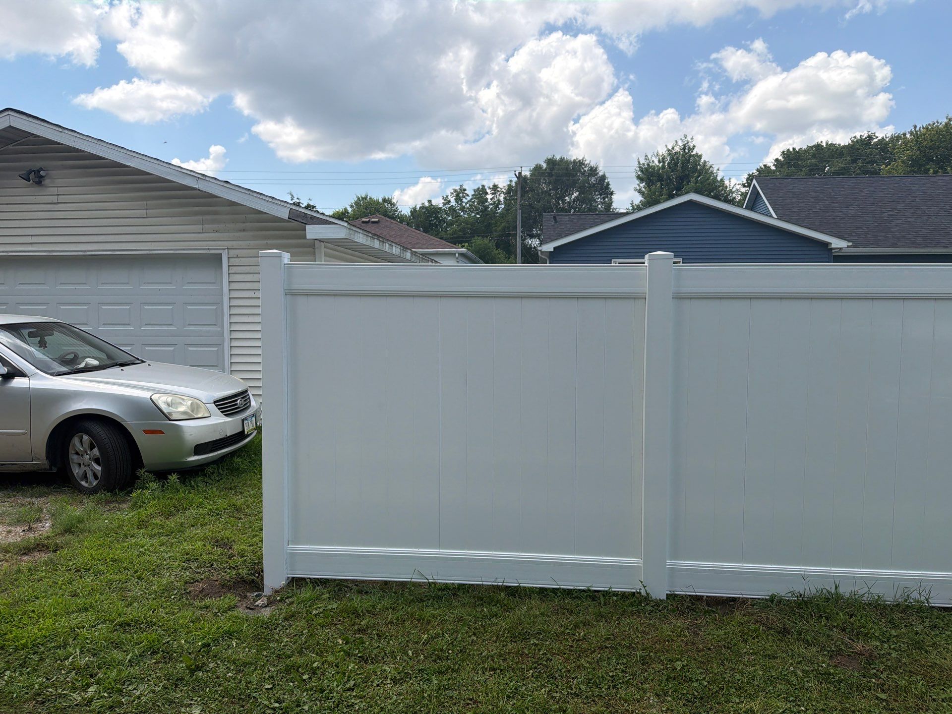 White Vinyl Privacy Fence Installation in Waterloo, Iowa by Perfect Picket Fence and Stain