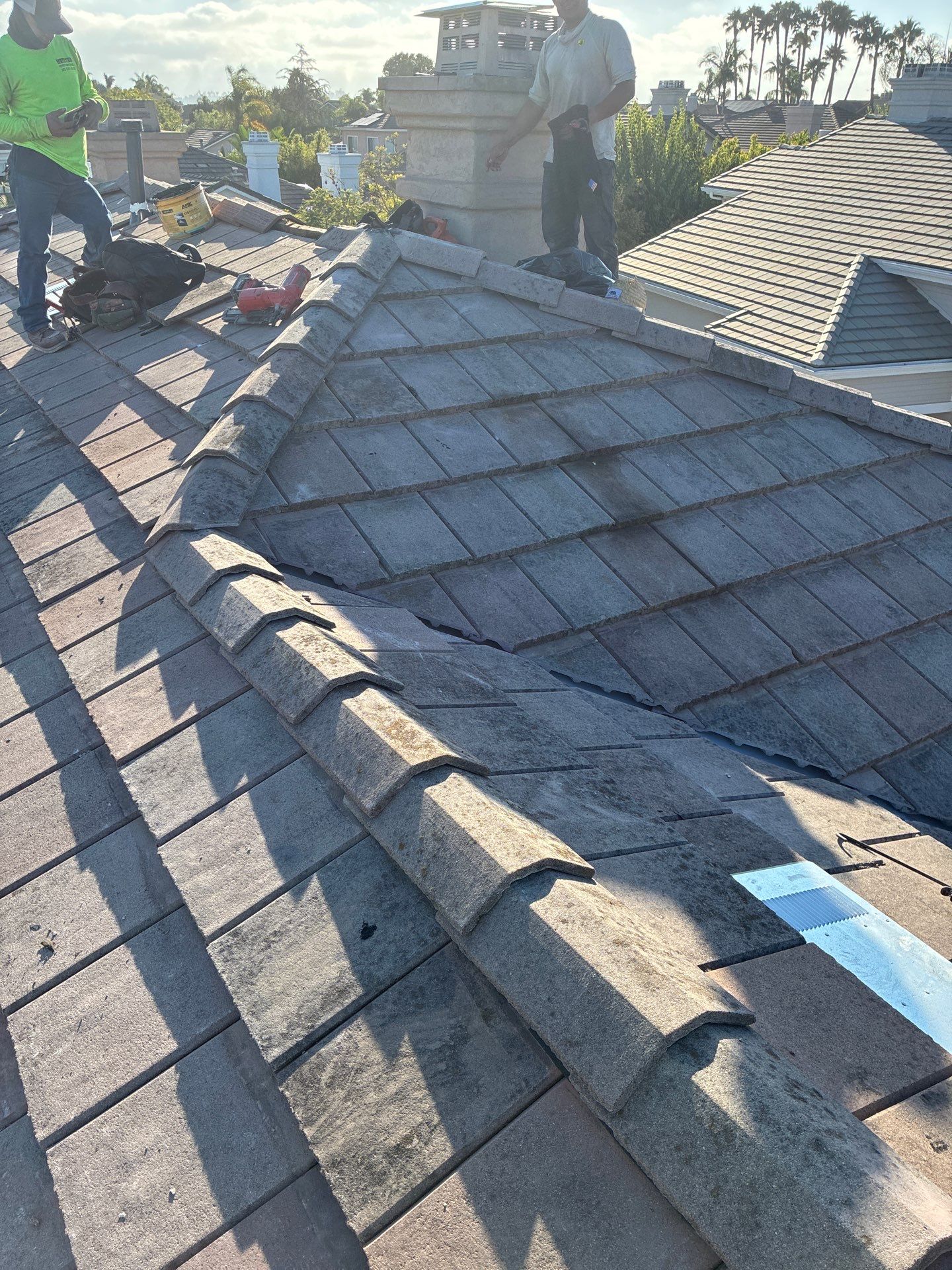 Carlsbad Concrete Tile Roof Replacement with Copper Flashing and Skylights by Reliable Roofing San Diego Inc.