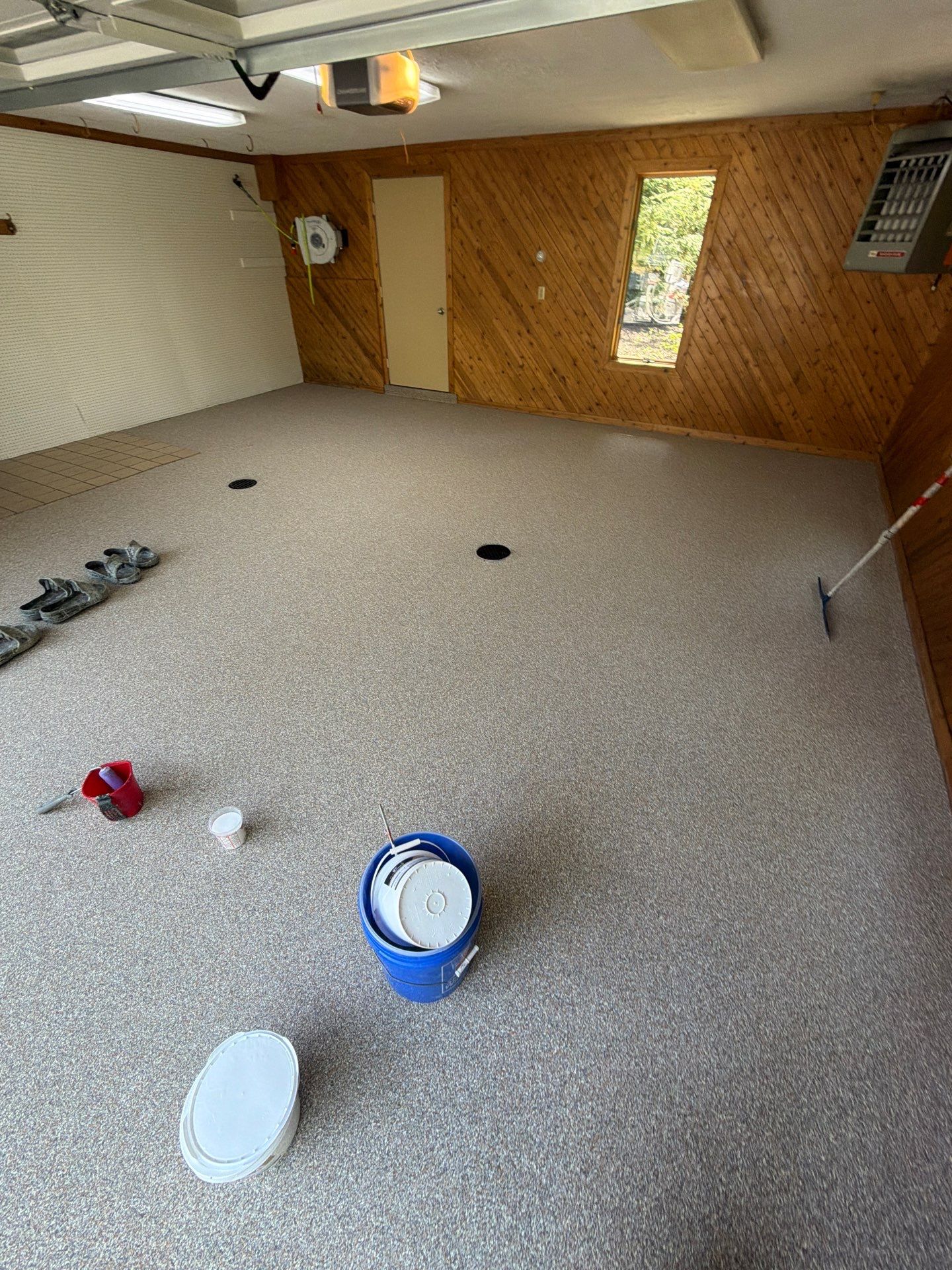 Grand Haven Garage Epoxy Floor Coating with Wax Wing Flake by Gordon Painting