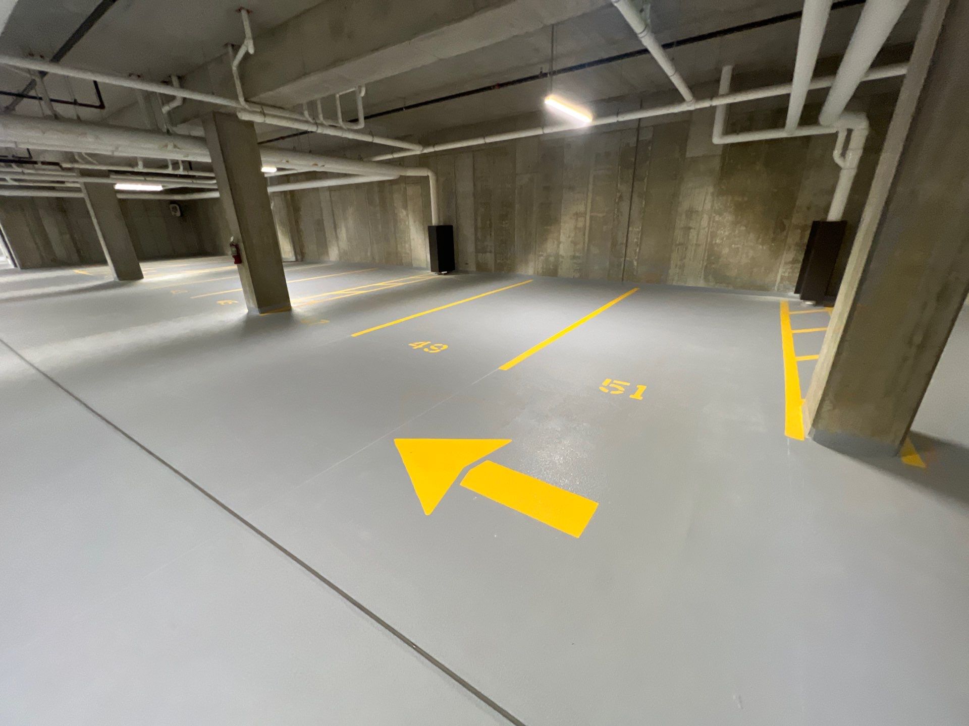 Parking garage using Hot water by Northern Power Washing LLC.