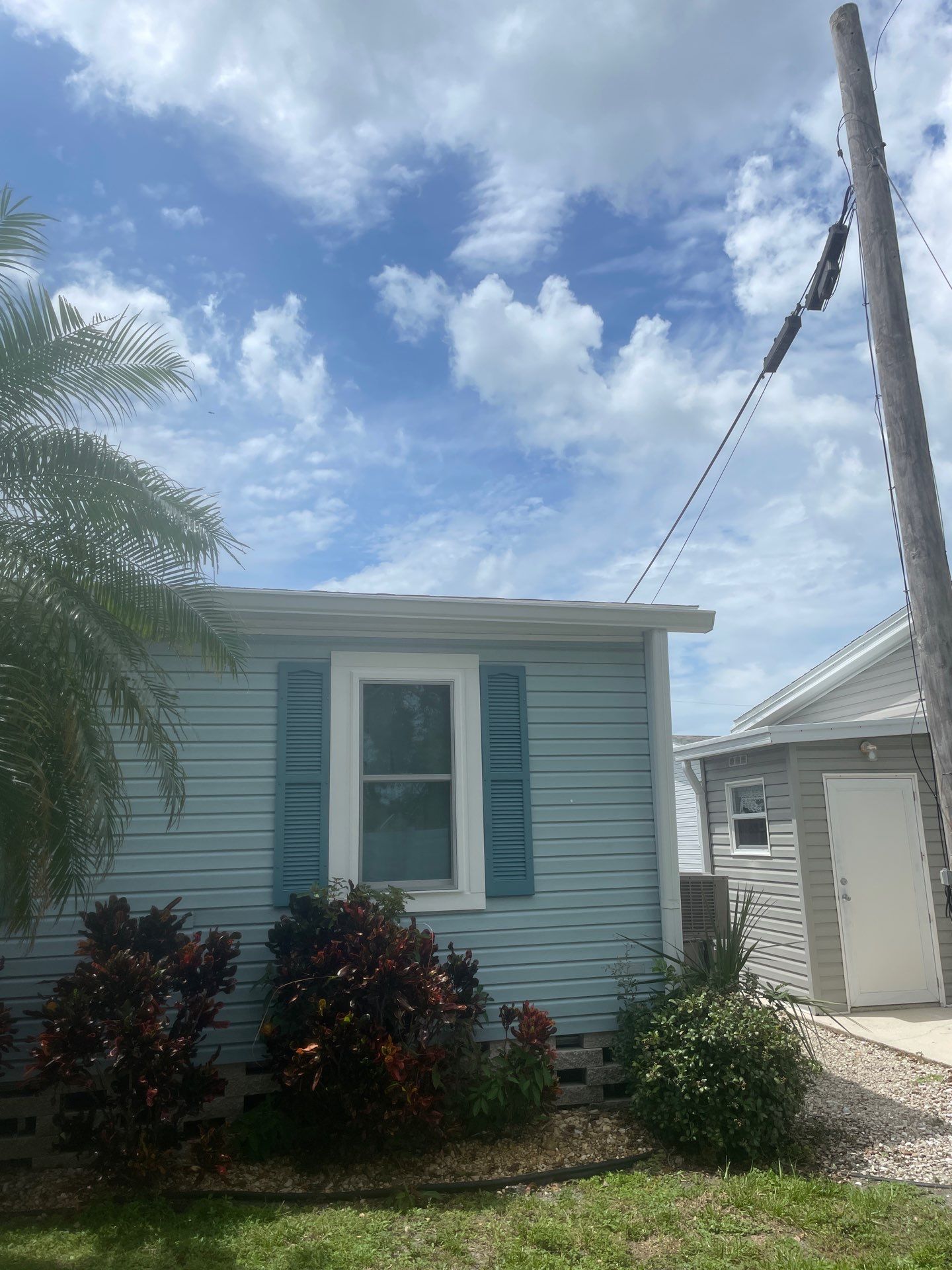 6-inch white seamless gutters in Sarasota FL by Gutter Professors