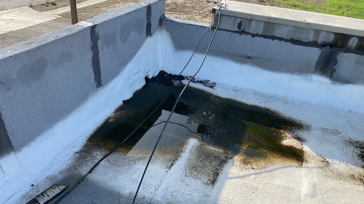 Spray foam and coatings using Conklin Benchmark/PUMA XL coatings and spray foam by Straight Edge Roofing Inc