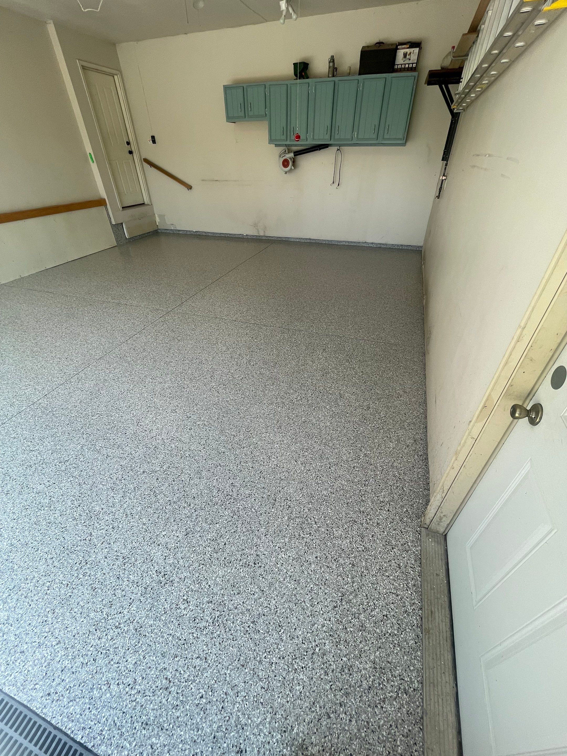 Multi-Stall Garage Floor Coating Installation in Sioux Falls by Select Painting, Coatings & Garage Cabinets