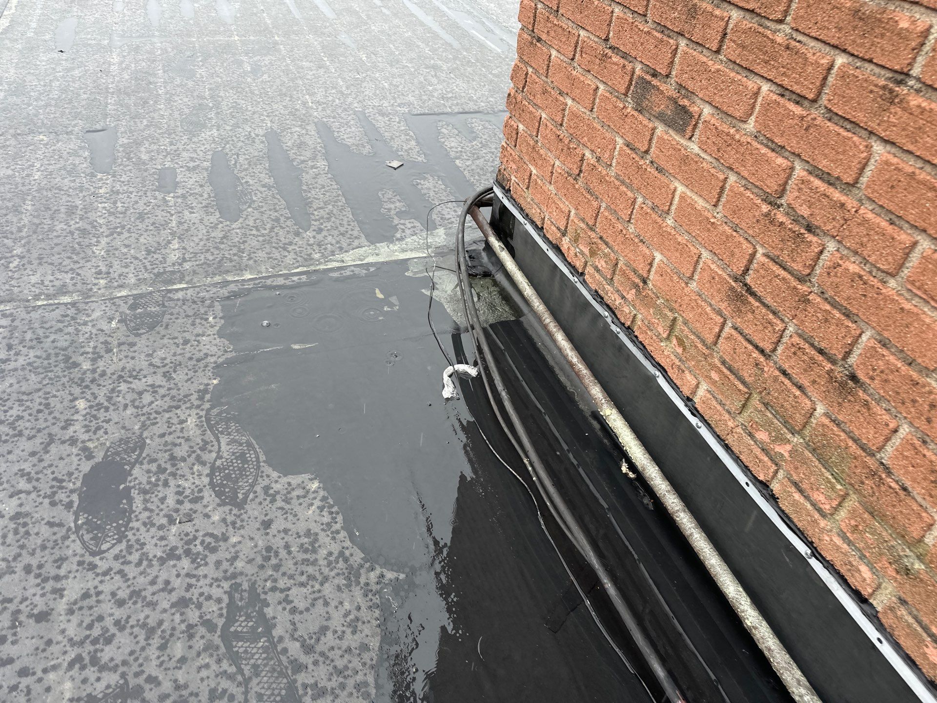 Commercial Roofing Installation using 60 mil rubber roof  by Nitro Roofing and Construction
