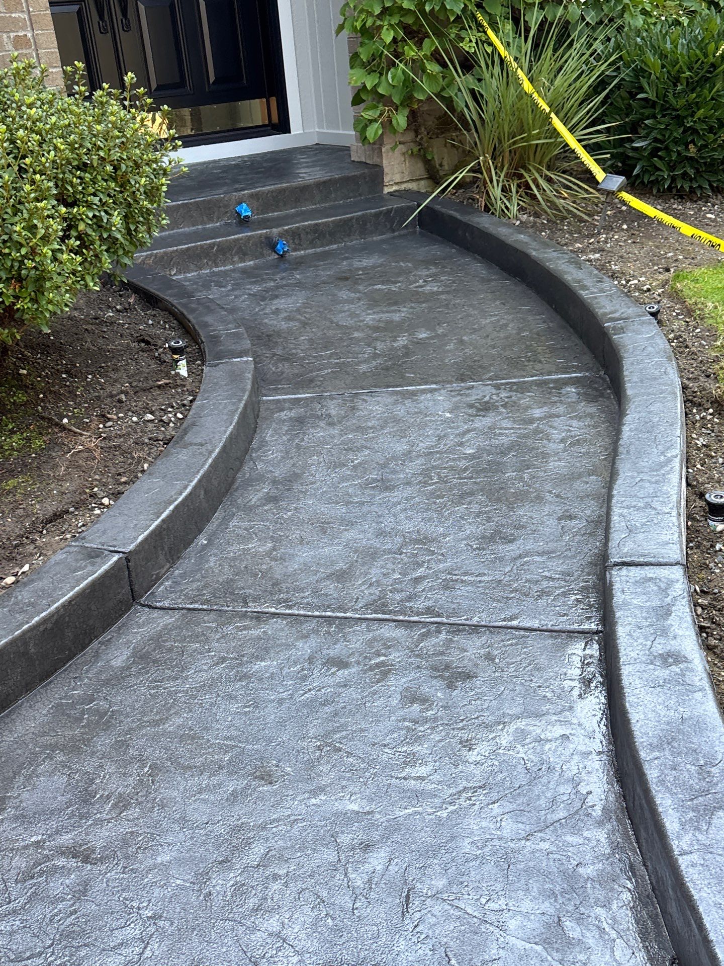 Multi-color Stamped & Sealed Concrete Driveway Renovation | Mukilteo by Jireh Asphalt & Concrete Inc