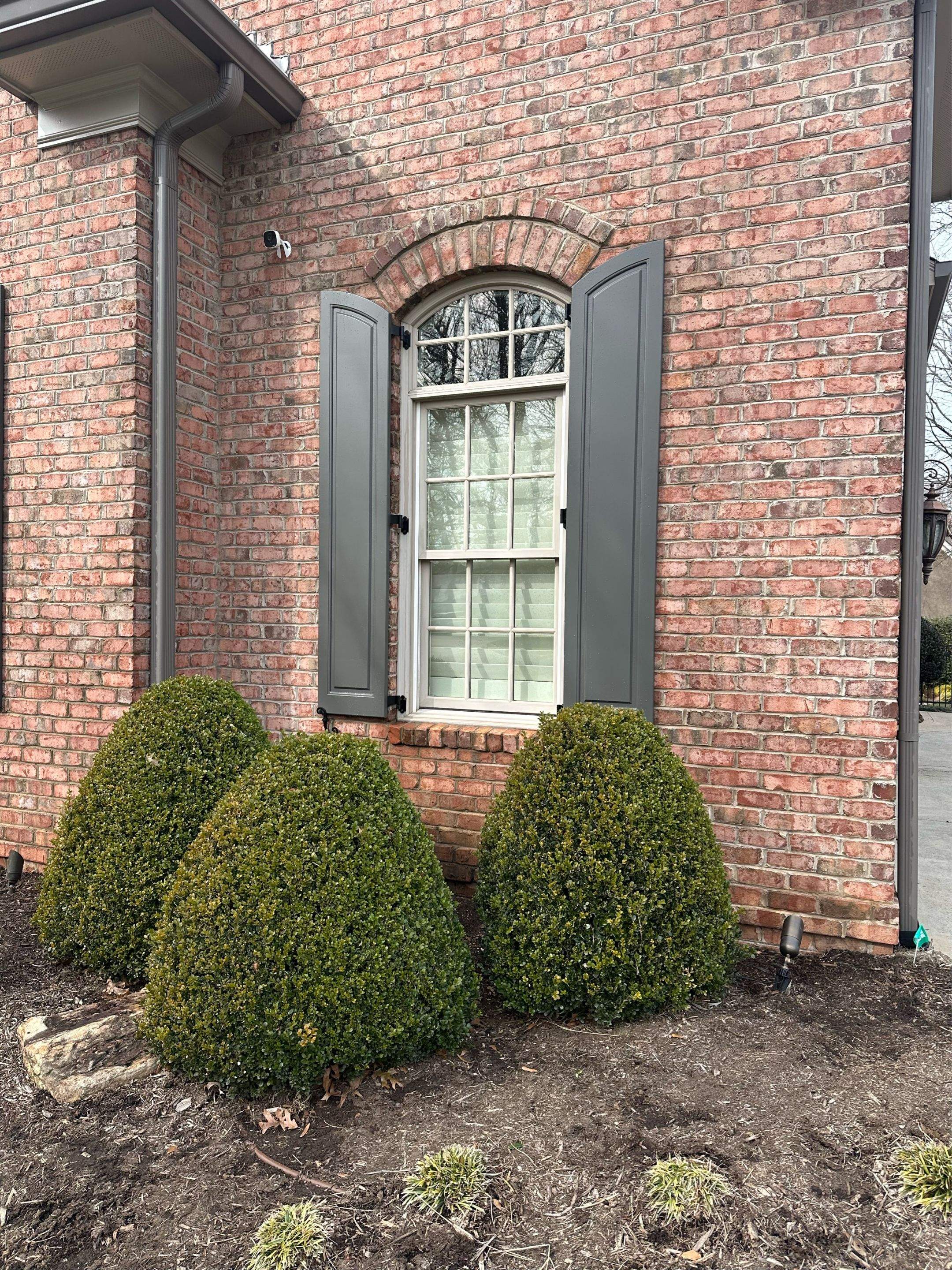 Exterior raised panel shutters by Southern Traditions Window Fashions