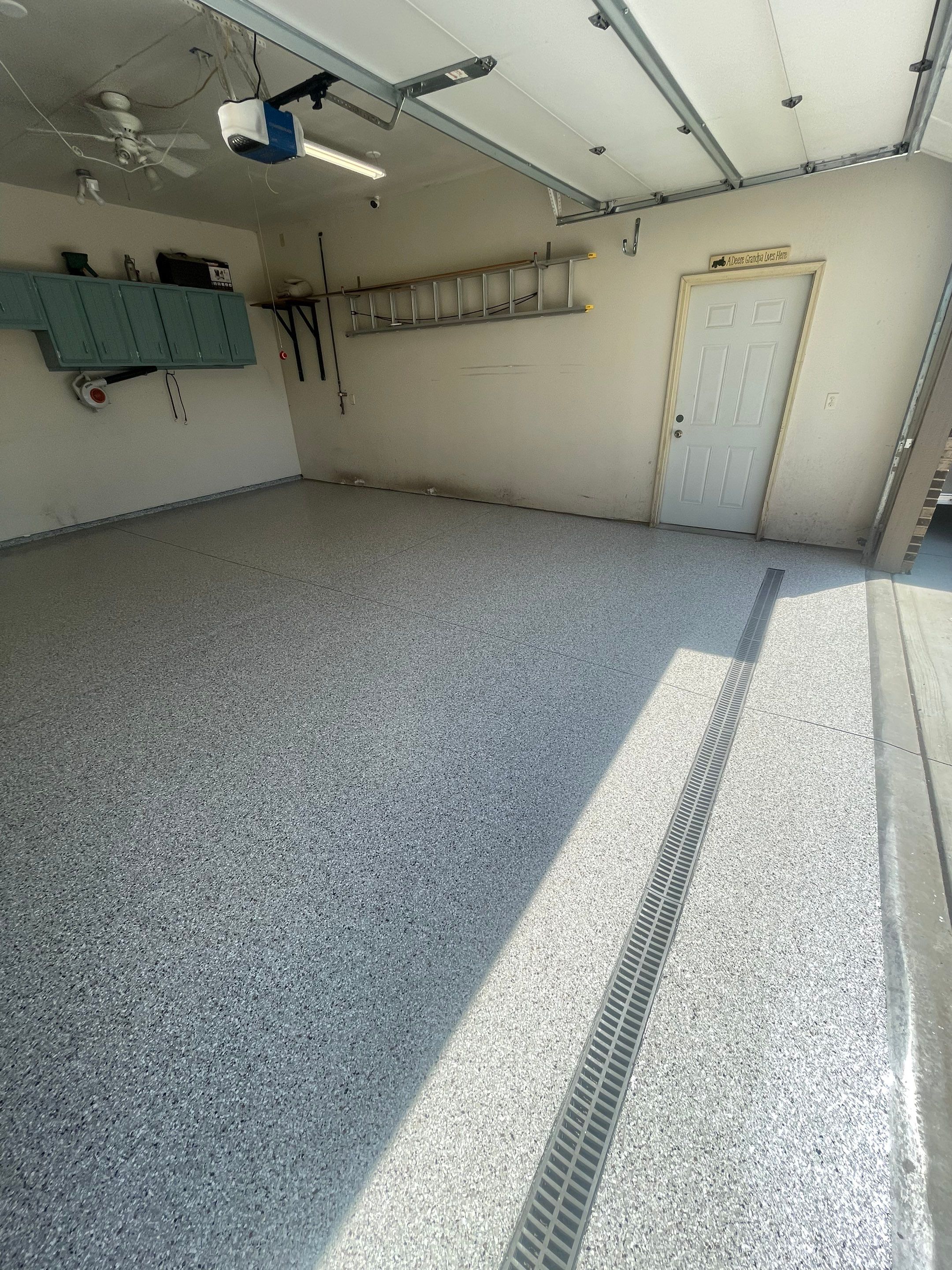 Multi-Stall Garage Floor Coating Installation in Sioux Falls by Select Painting, Coatings & Garage Cabinets
