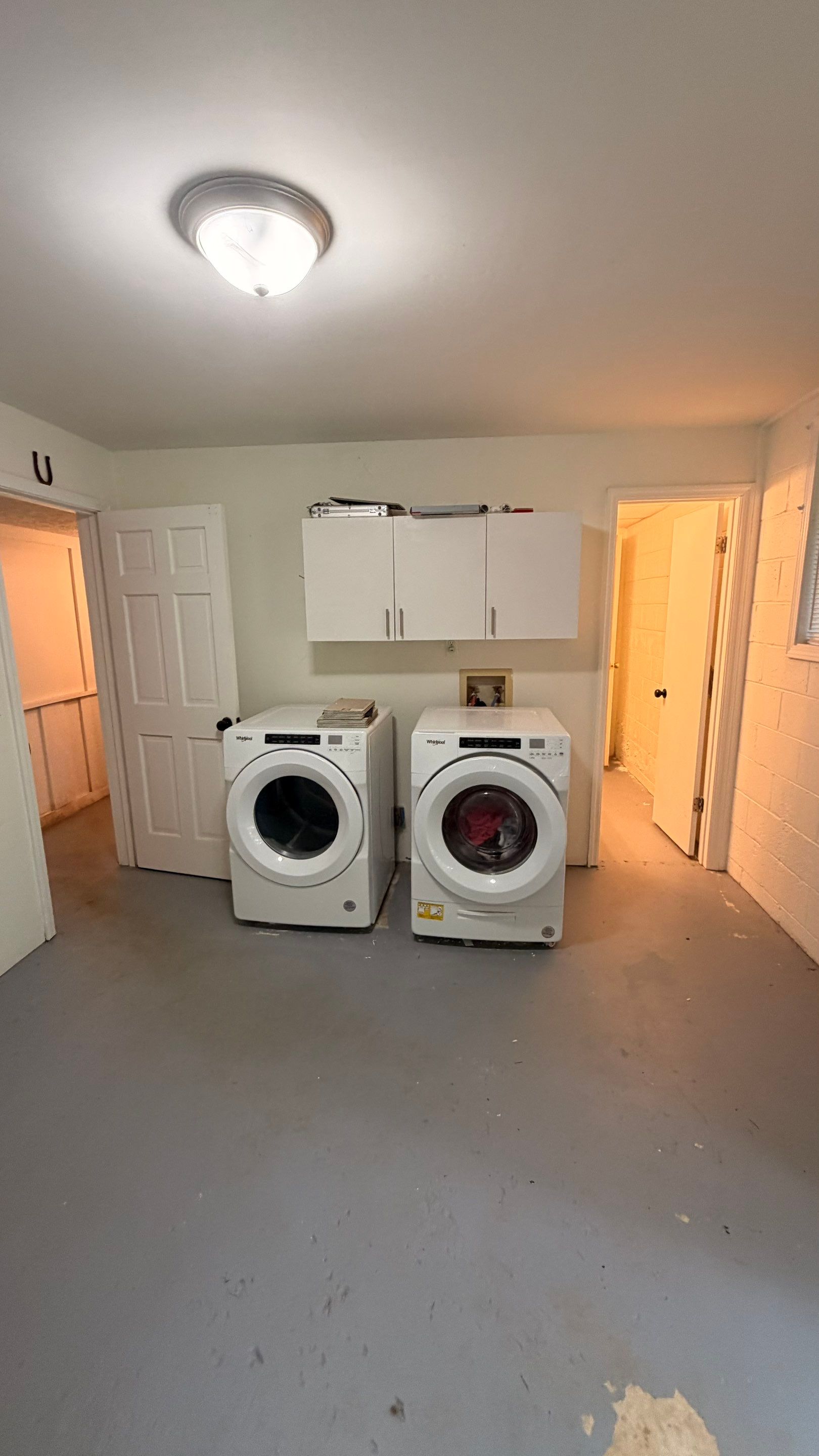 Basement Remodeling with Wood-Look Flooring and Custom Wainscoting in Dunwoody by Swift Home Renovations