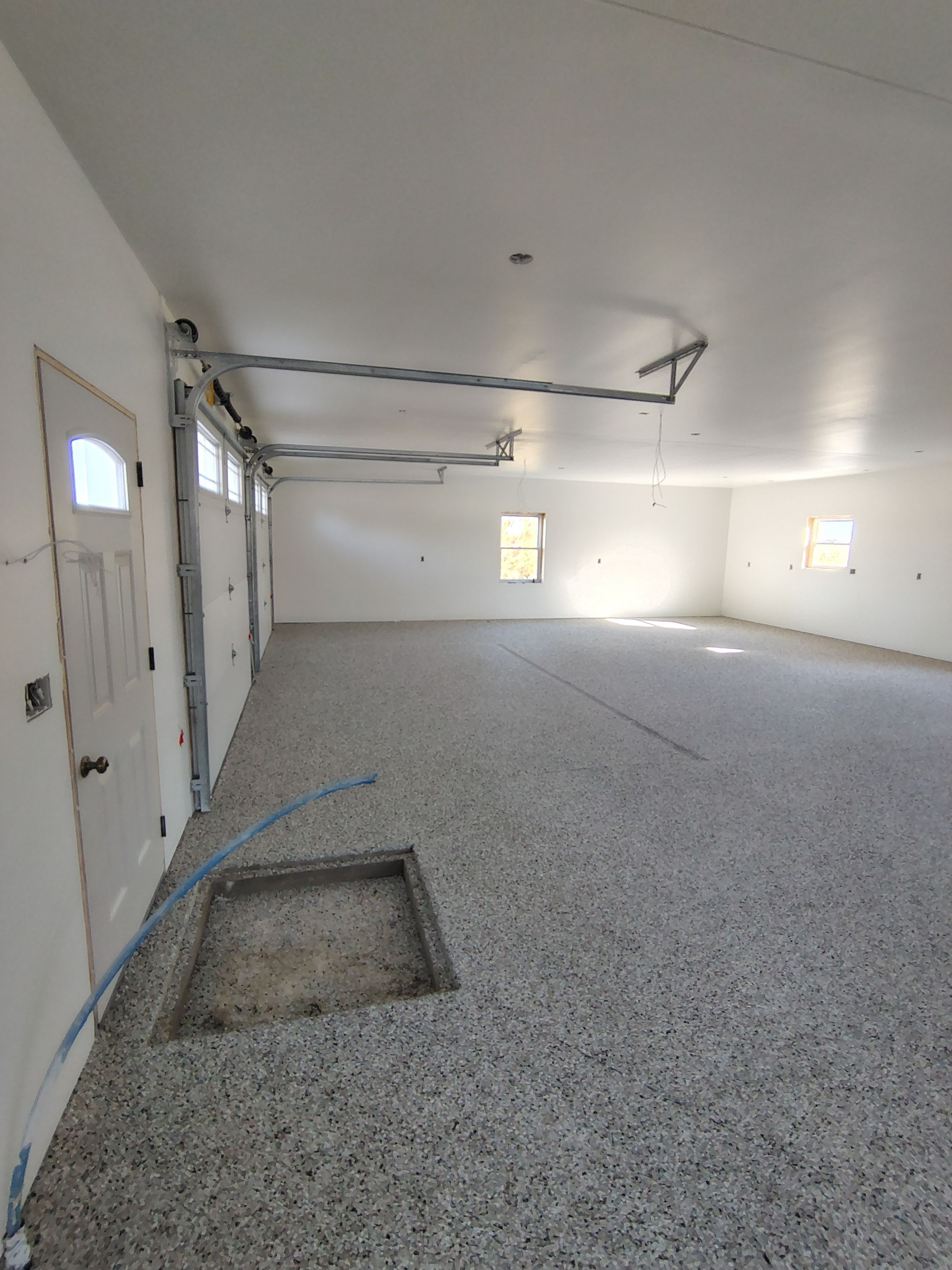 Custom Garage and Basement Epoxy Floor Coating in Menno by Select Painting, Coatings & Garage Cabinets