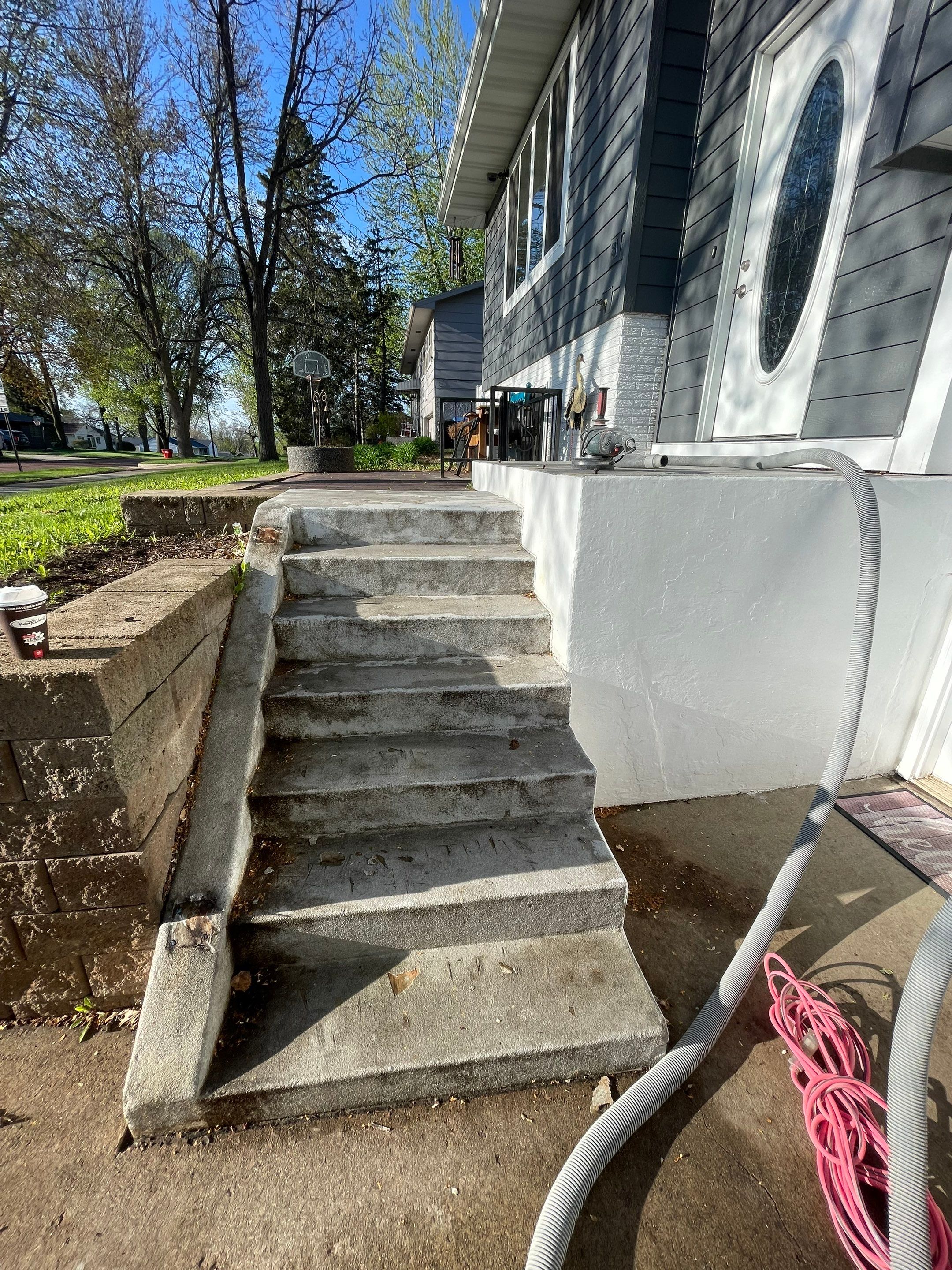 Grey Polyaspartic Porch and Stair Resurfacing in Sioux Falls by Select Painting, Coatings & Garage Cabinets