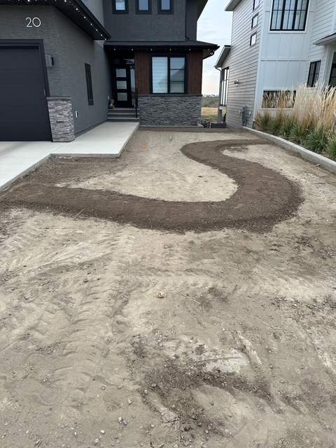 Decorative Concrete Curbing and River Rock Landscape Installation by Pump it Up Concrete Jacking