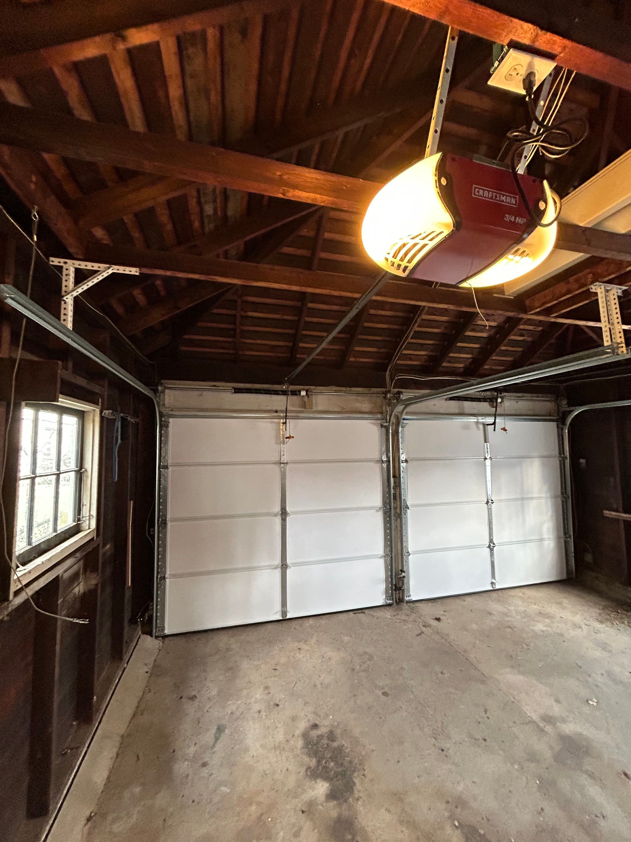 Double Garage Door Upgrade for a Clean, Unified Look by DiGiorgi Roofing and Siding Inc