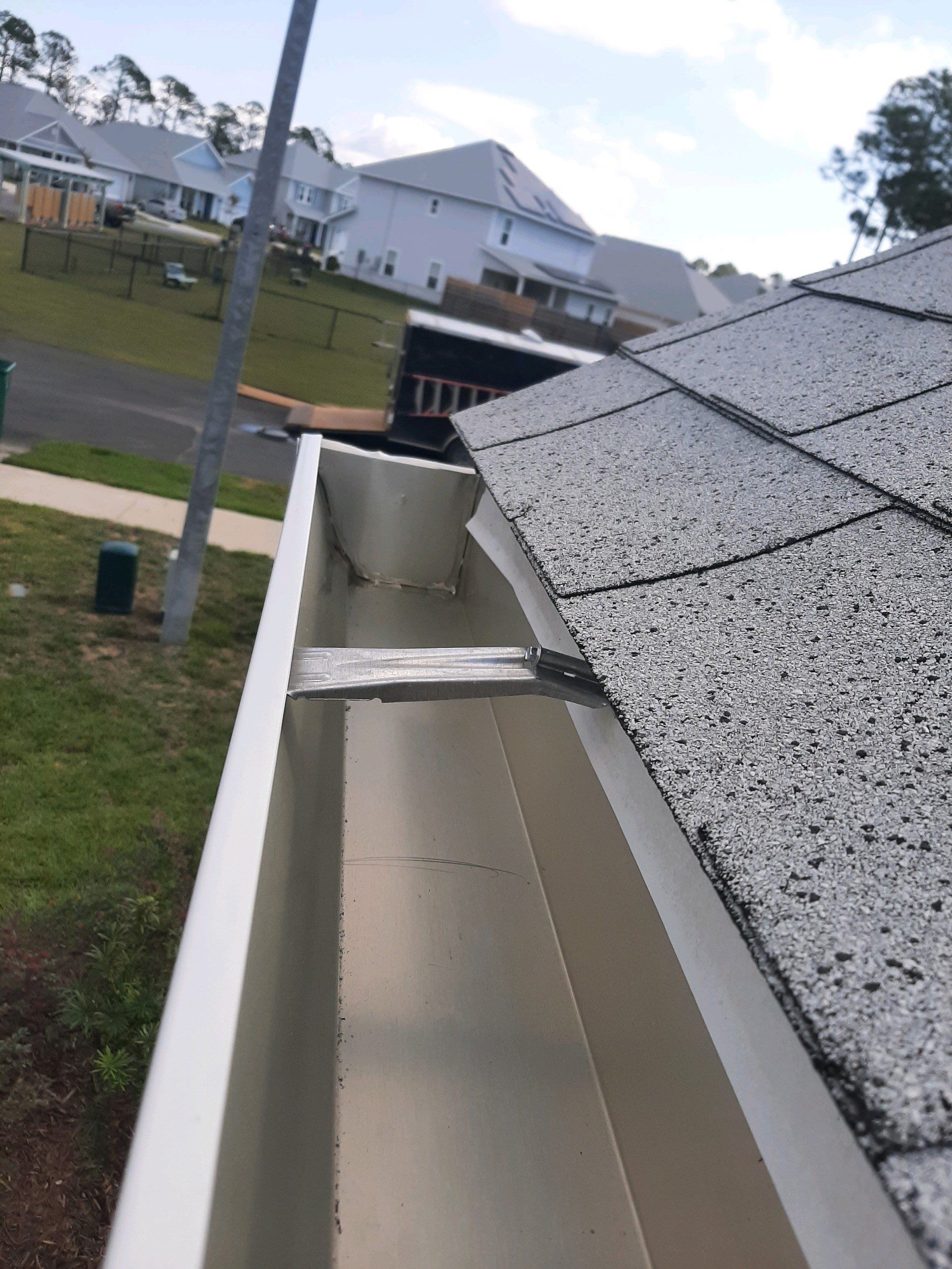 Seamless Gutter Installation using White by Gutter Professors