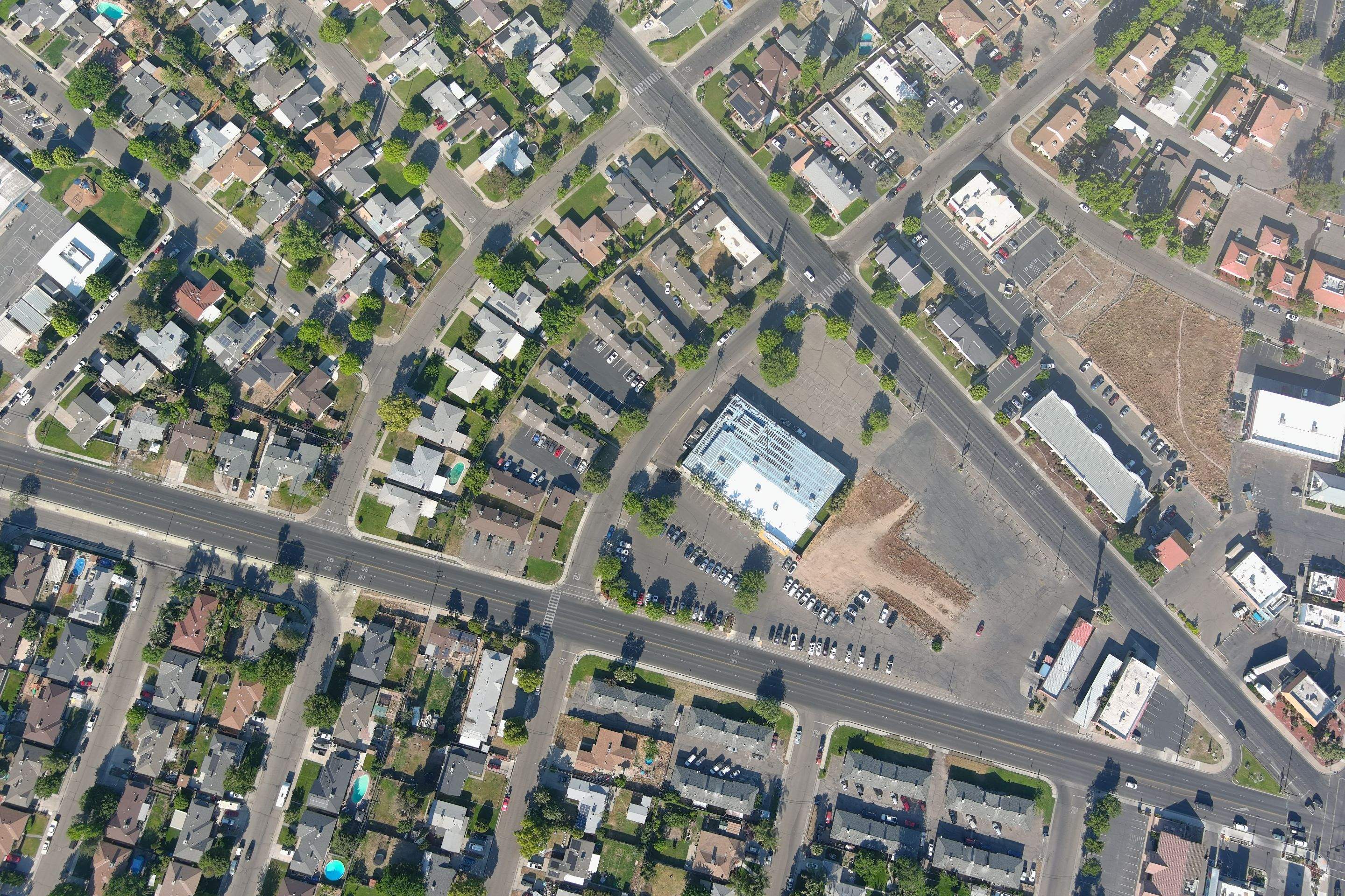 Metal roof restoration on commercial roof using Conklin Benchmark/ PUMA XL acrylic coatings over metal and foam by Straight Edge Roofing Inc