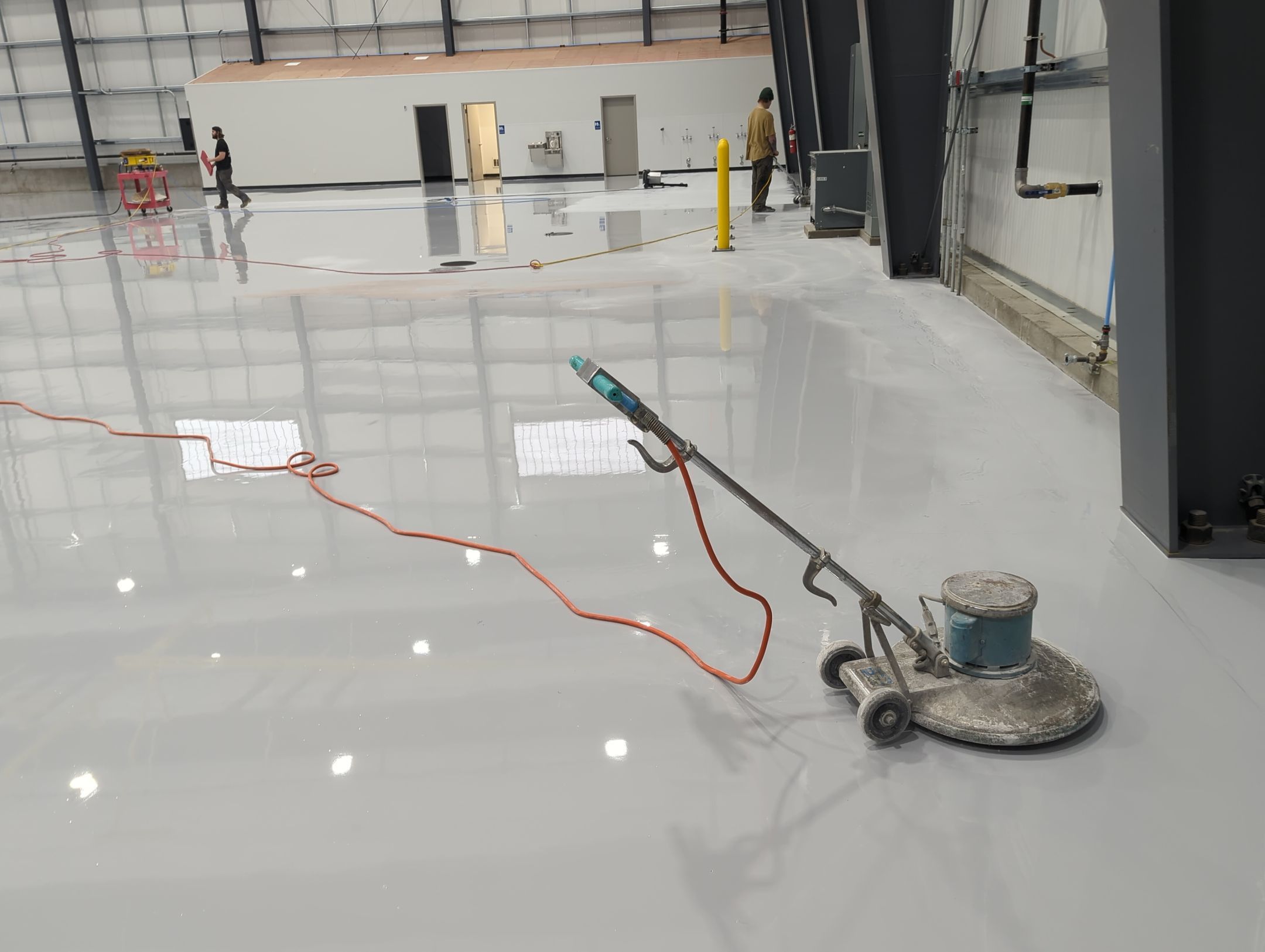 Airplane Hanger using Light Grey Commercial Penntek Epoxy by Croc Coatings, LLC