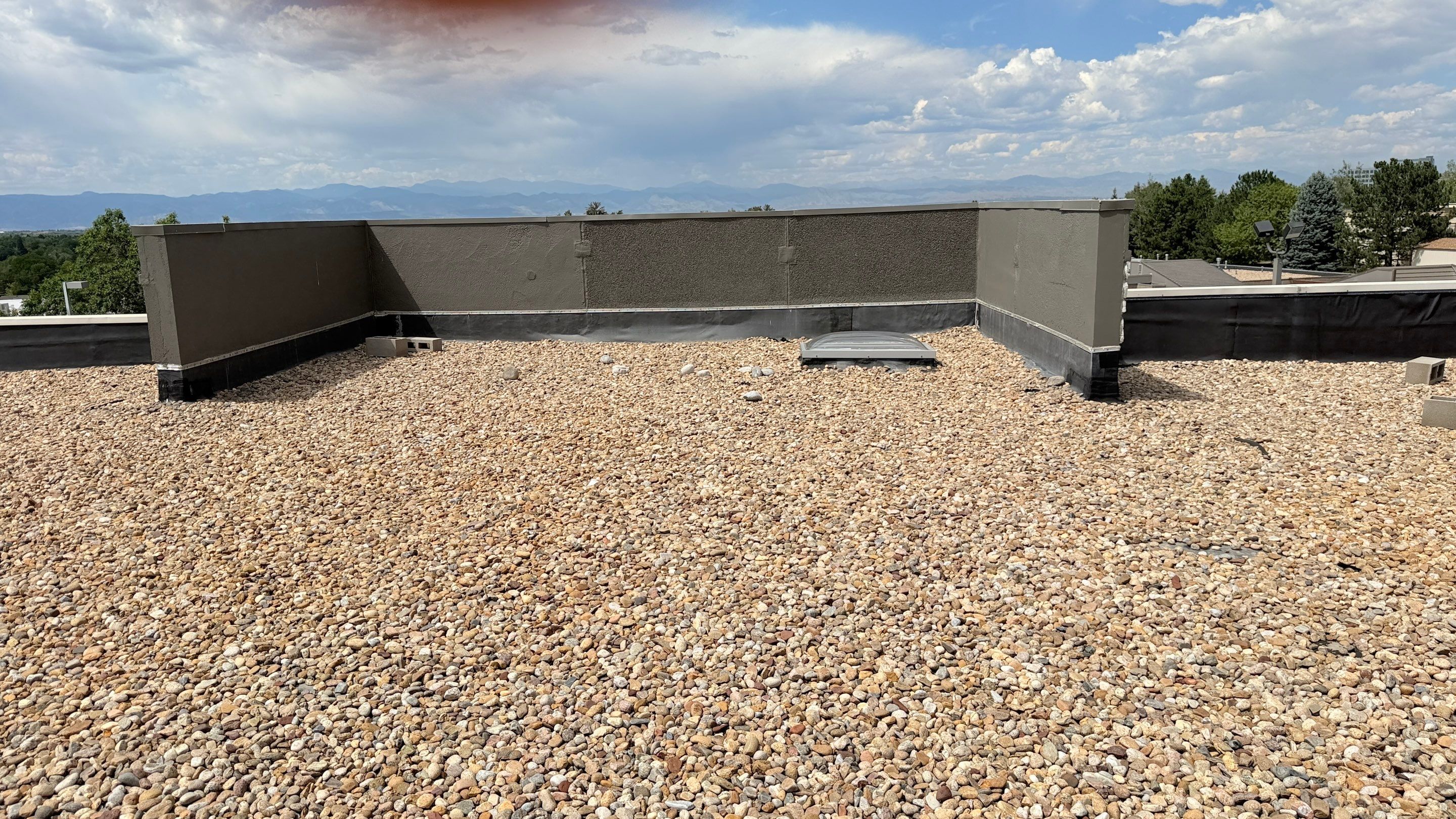 EPDM Commercial Roof Repair and Ballast Maintenance in Centennial by Rhino Roofing LLC