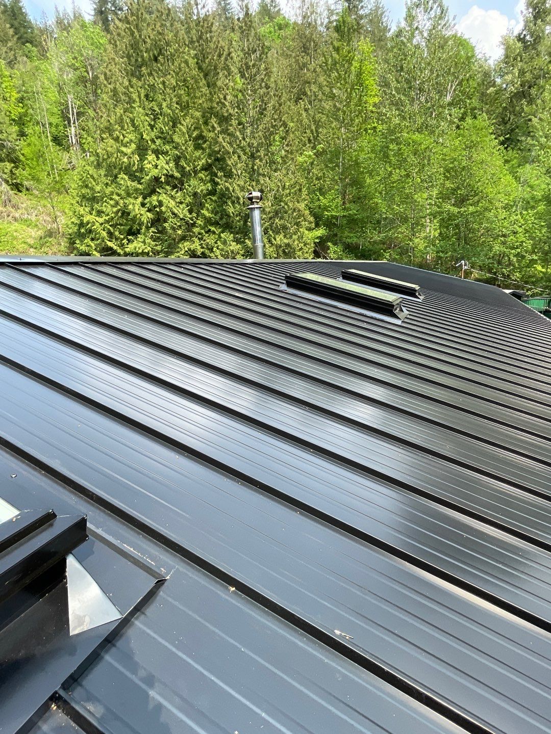 Residential ReRoofing Installation using 12" Prolok metal by Top Notch Roofing Inc