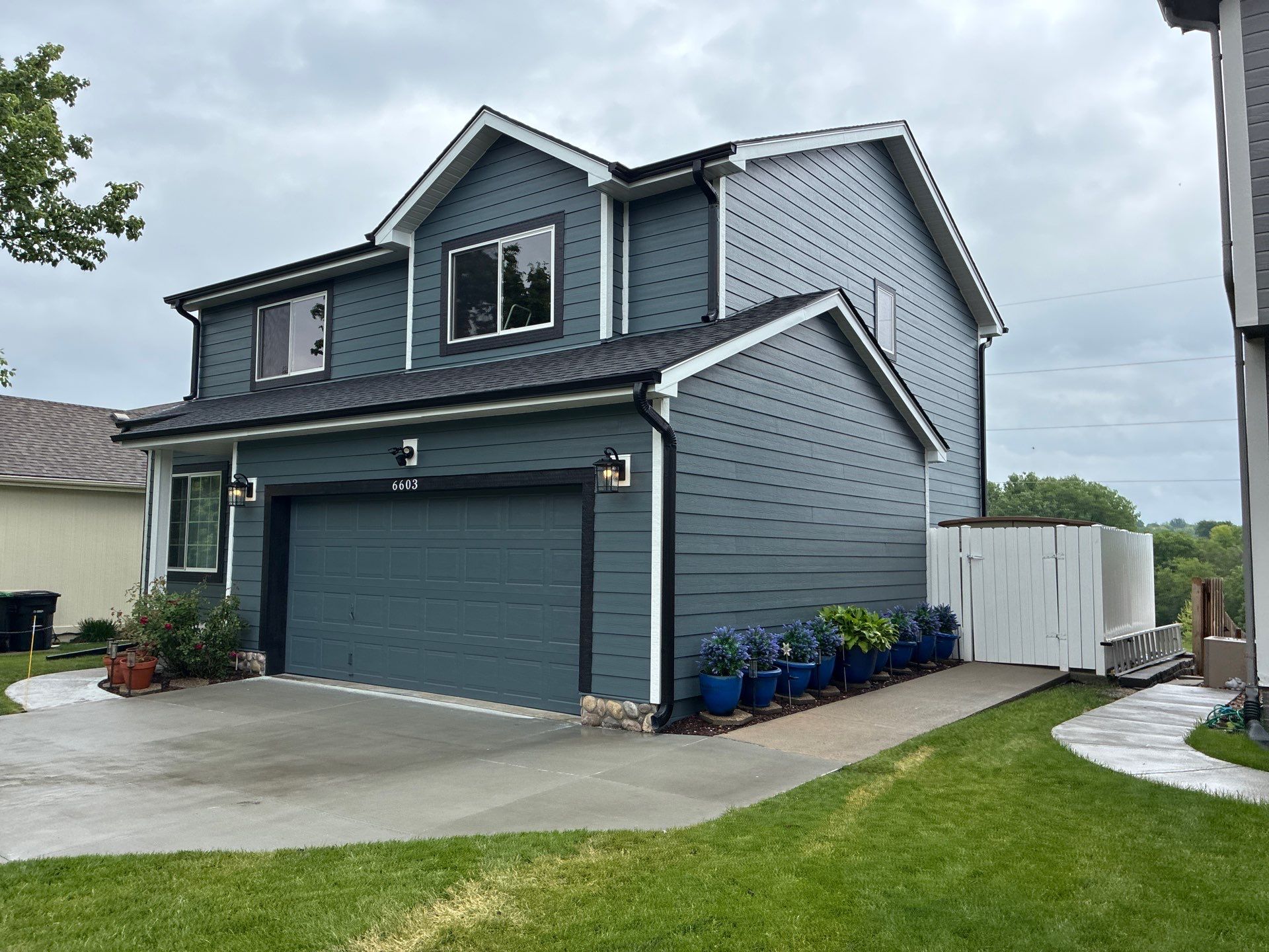 James Hardie Siding and Window Replacement with Arctic White Trim by Carps Complete Exteriors