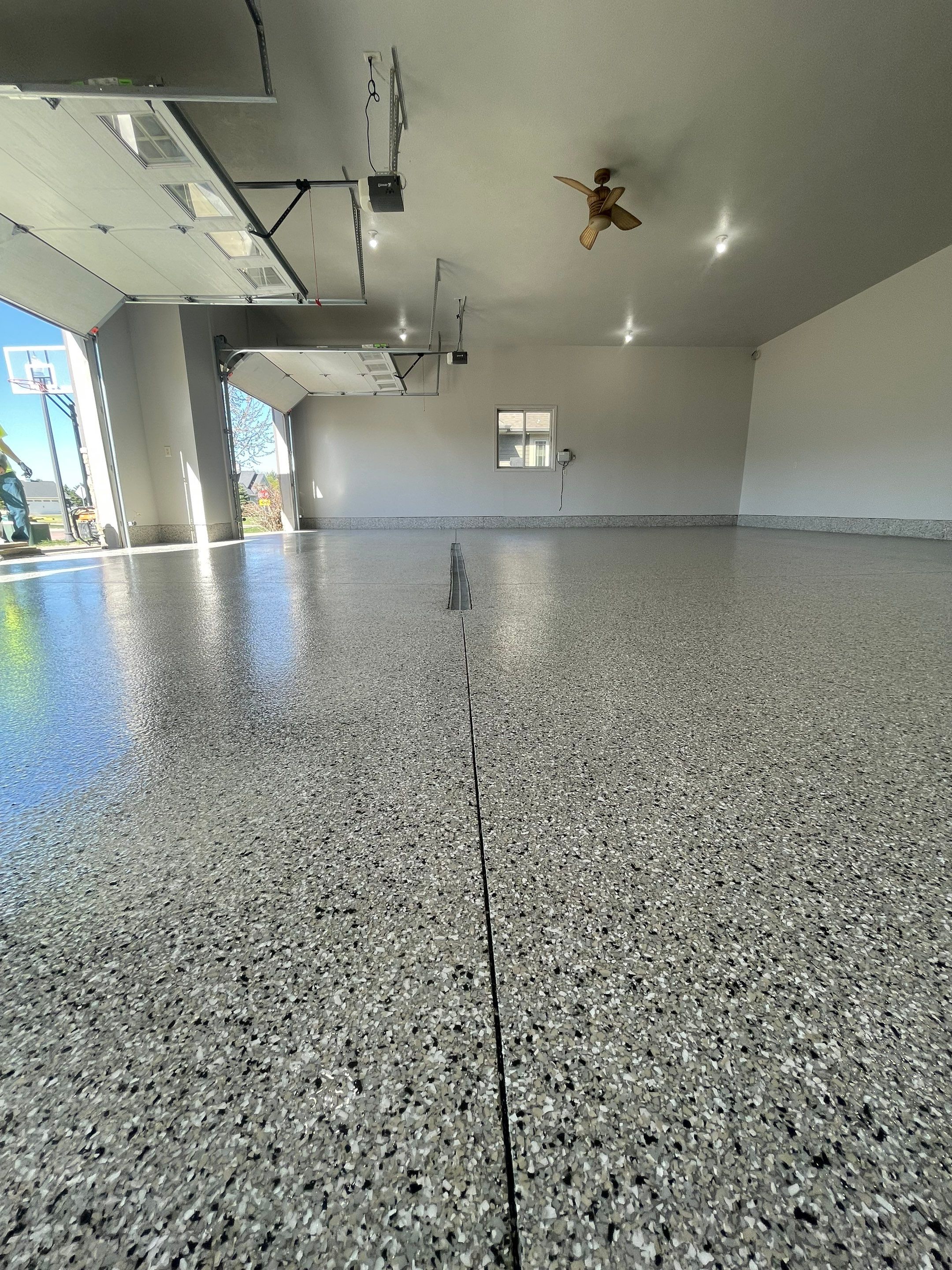Multi-Car Garage Epoxy Floor Coating in Beresford by Select Painting, Coatings & Garage Cabinets