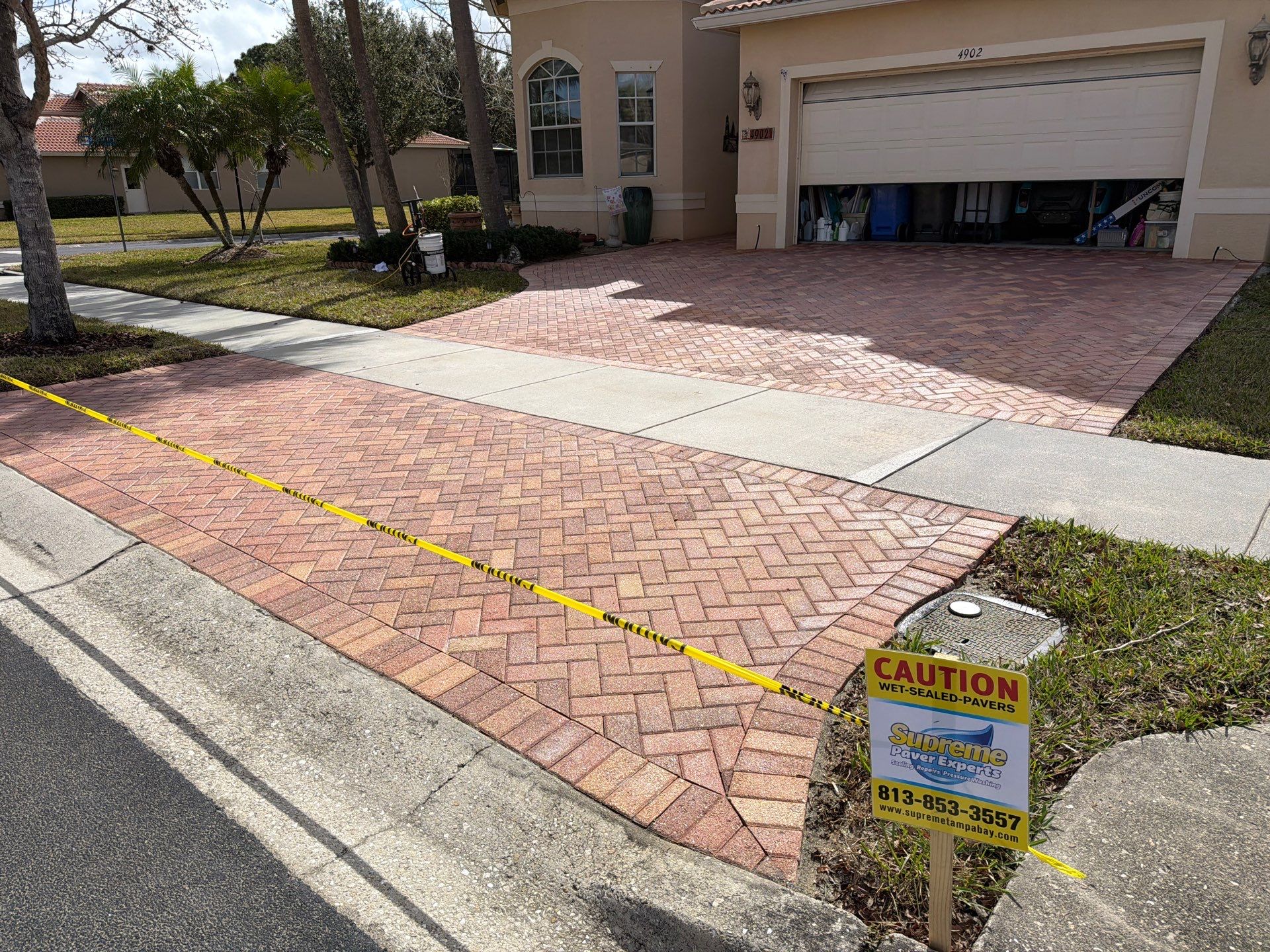 Paver Sealing for Herringbone Driveway and Screened Lanai in Valencia Lakes by Supreme Paver Experts