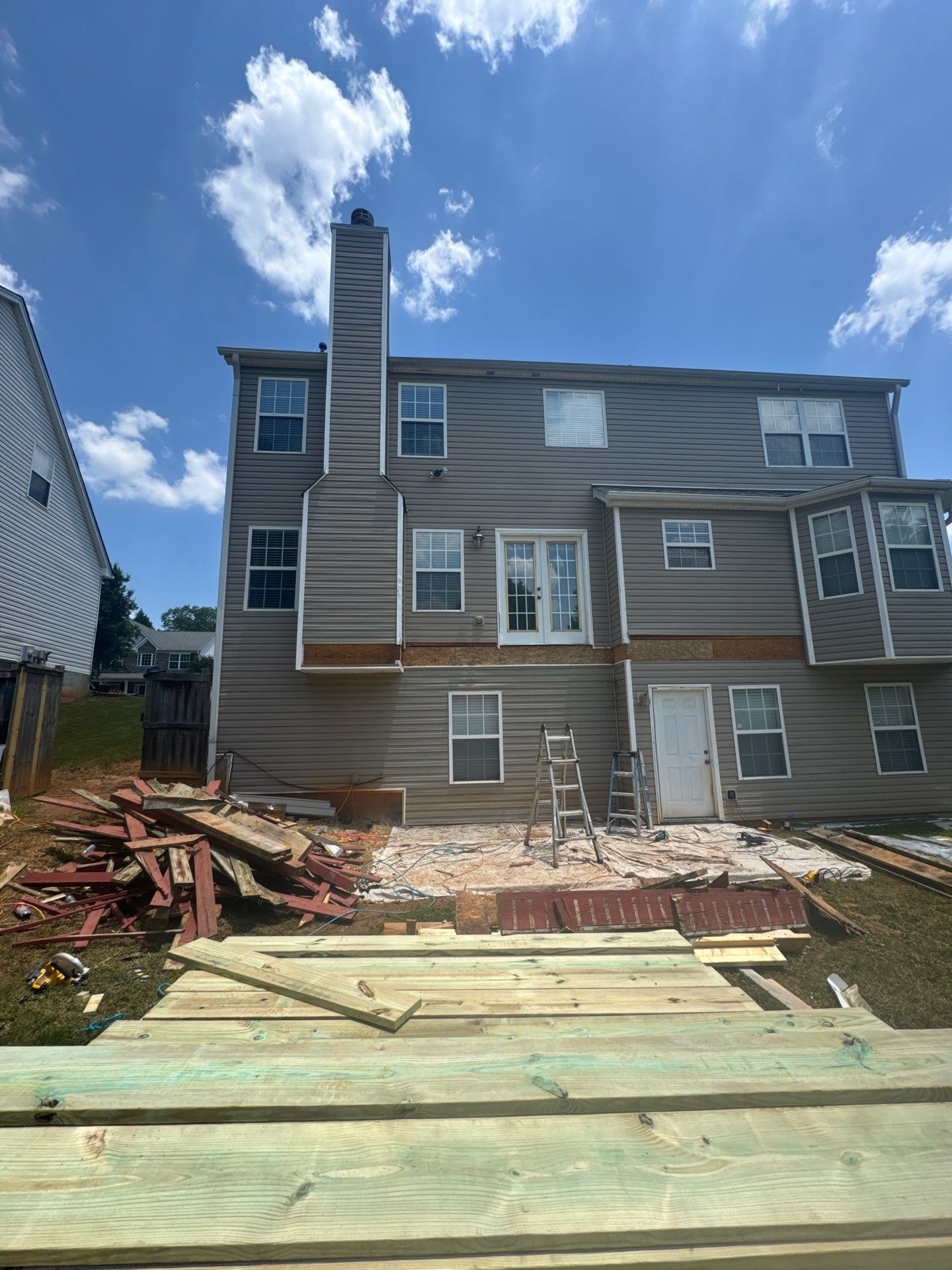 Backyard Deck Expansion & Custom Staircase Installation in Suwanee. by Swift Home Renovations