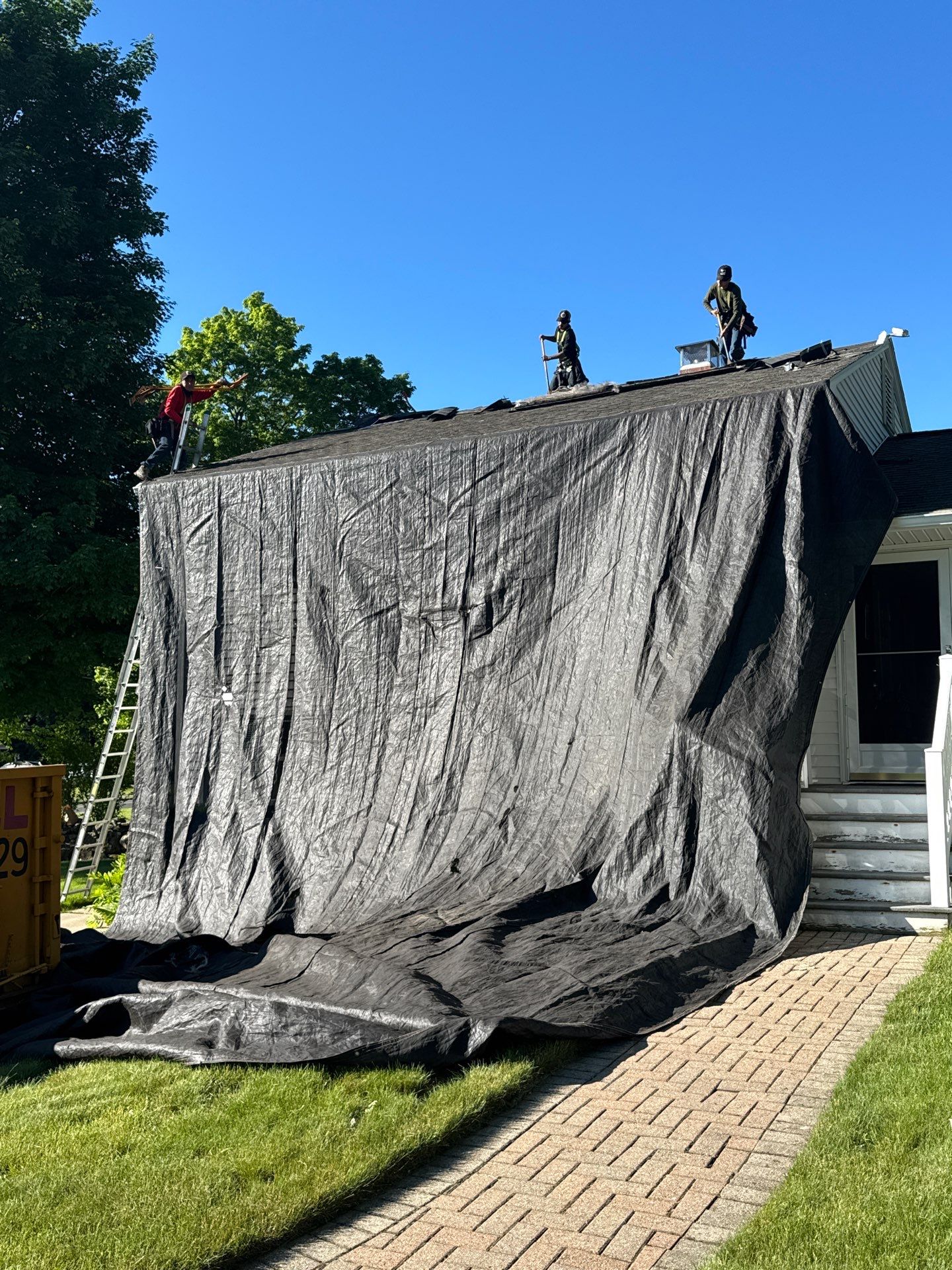 Beautiful new asphalt shingles on a roof in Vernon! by DiGiorgi Roofing and Siding Inc
