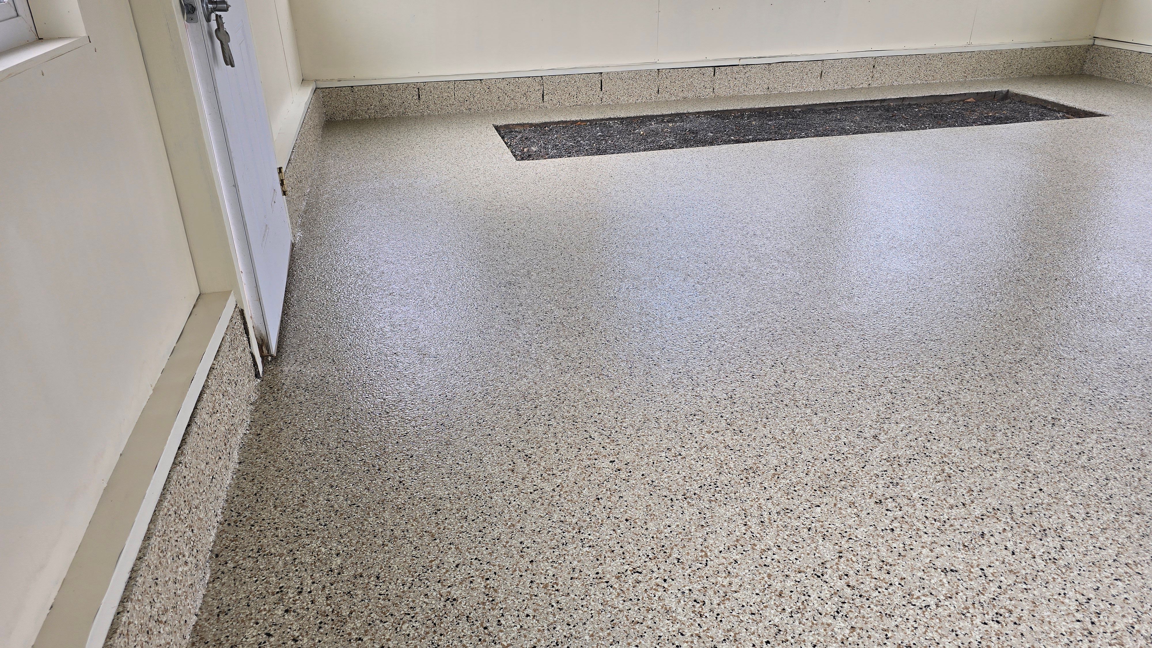 Two garages completed using Shoreline and Midnight by Elite Floor Solutions