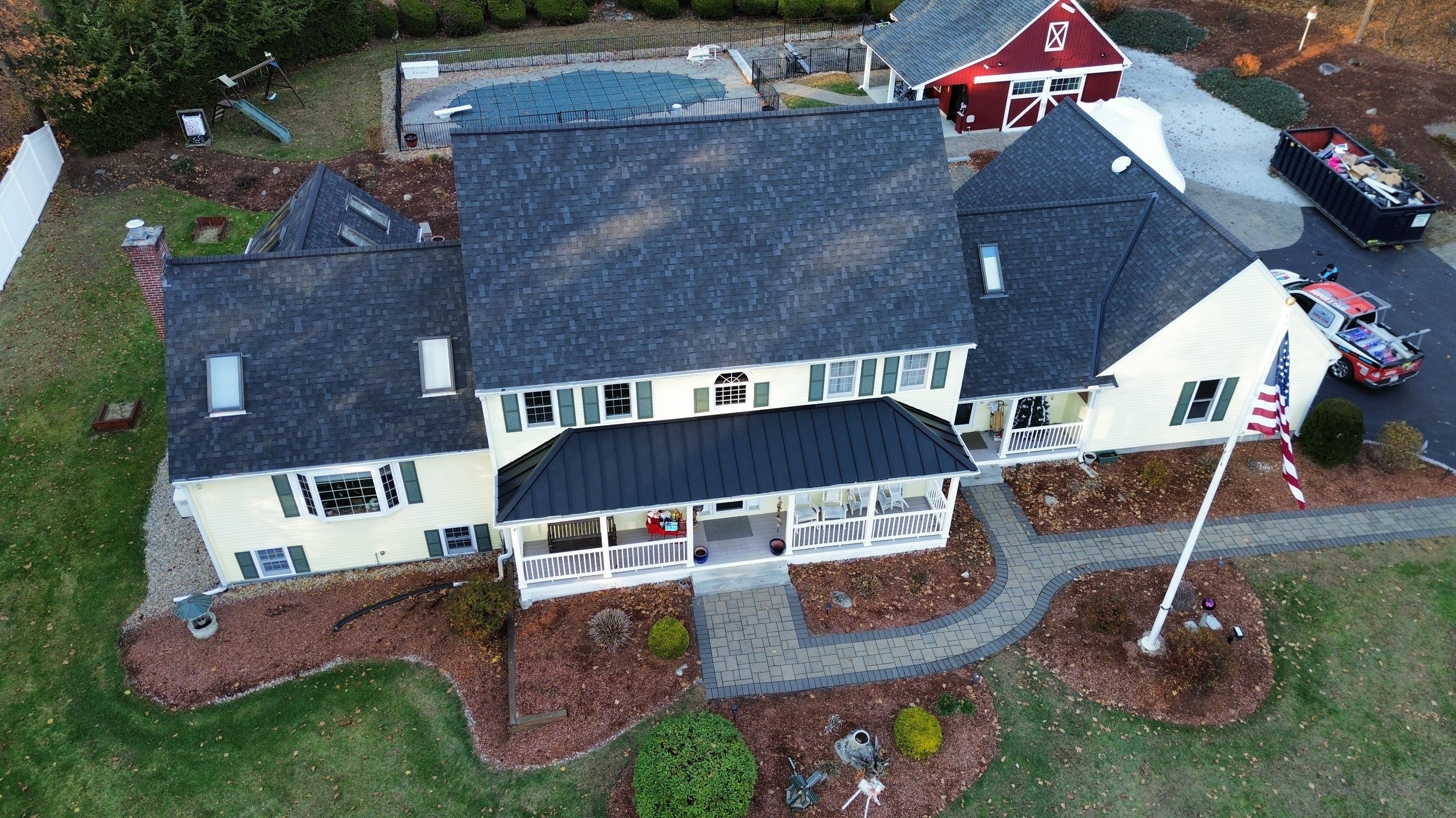 Chelmsford Premium Roof: Onyx Black Shingles with Standing Seam Metal Porch by Mighty Dog Roofing of Greater Middlesex County