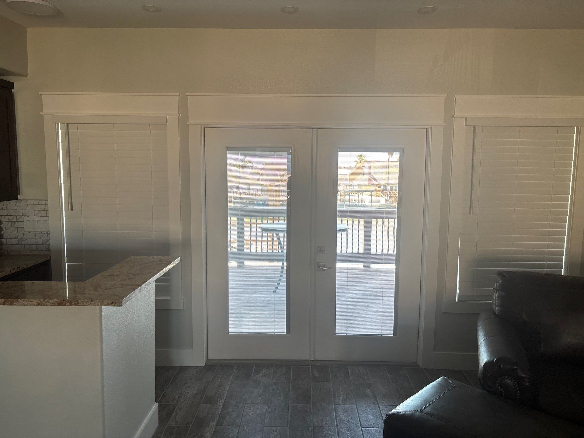 NWF Faux Wood Blinds and SWF Roller Shades by Budget Blinds of Greater Corpus Christi