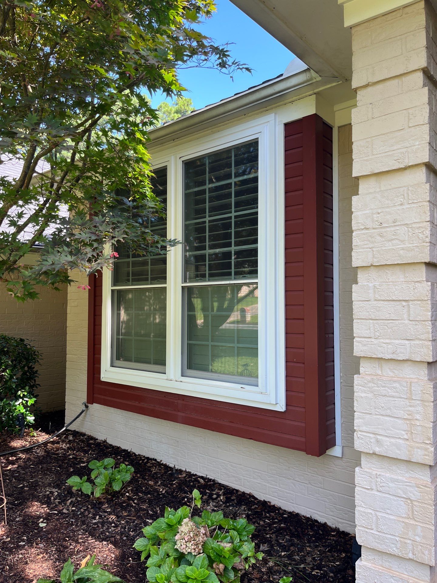 Exterior Painting in Tyler, TX | Brick House with White & Blue Finish by Quality Coats Painting