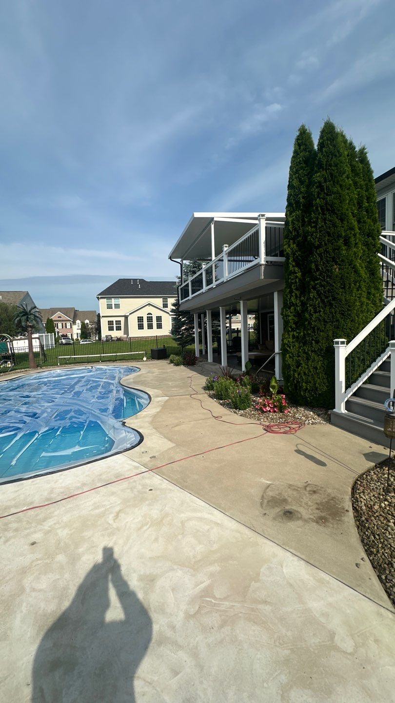 Twilight Pool Deck / Patio Project in Beaver falls by Floors in a Day, Inc