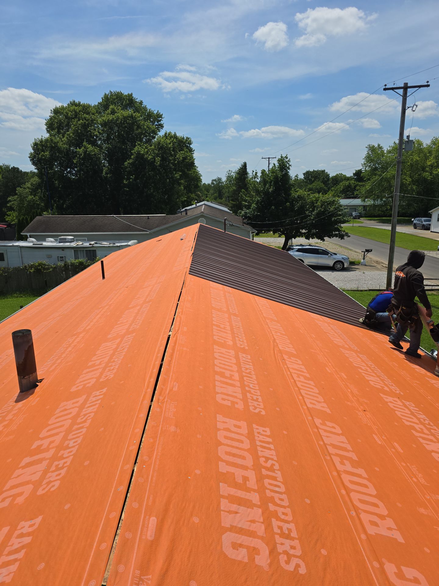 Residential Roofing Installation using Metal by Rainstoppers Roofing