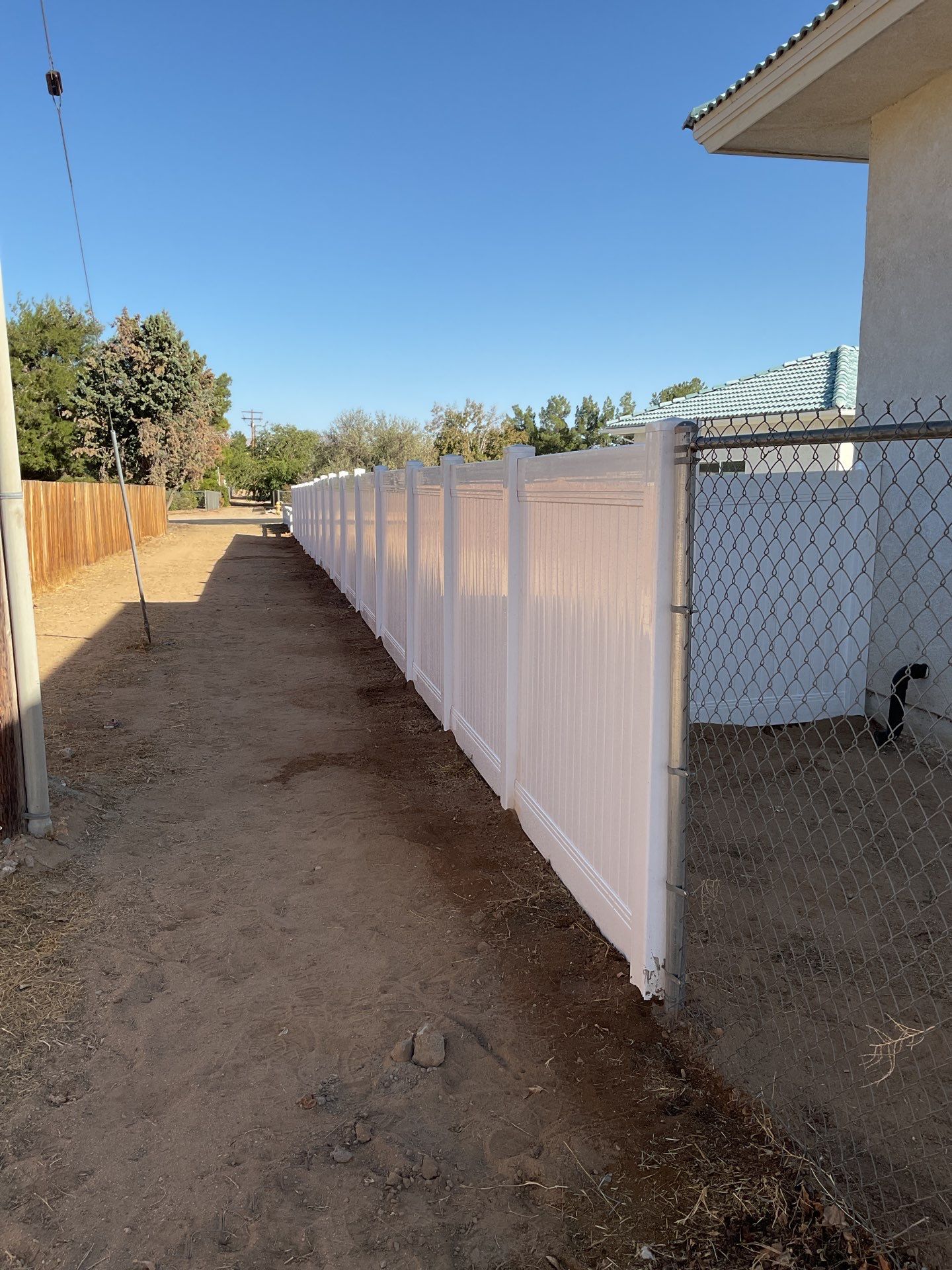 Fence Installation using Ranch Style Vinyl by Fence Guys Inc. 