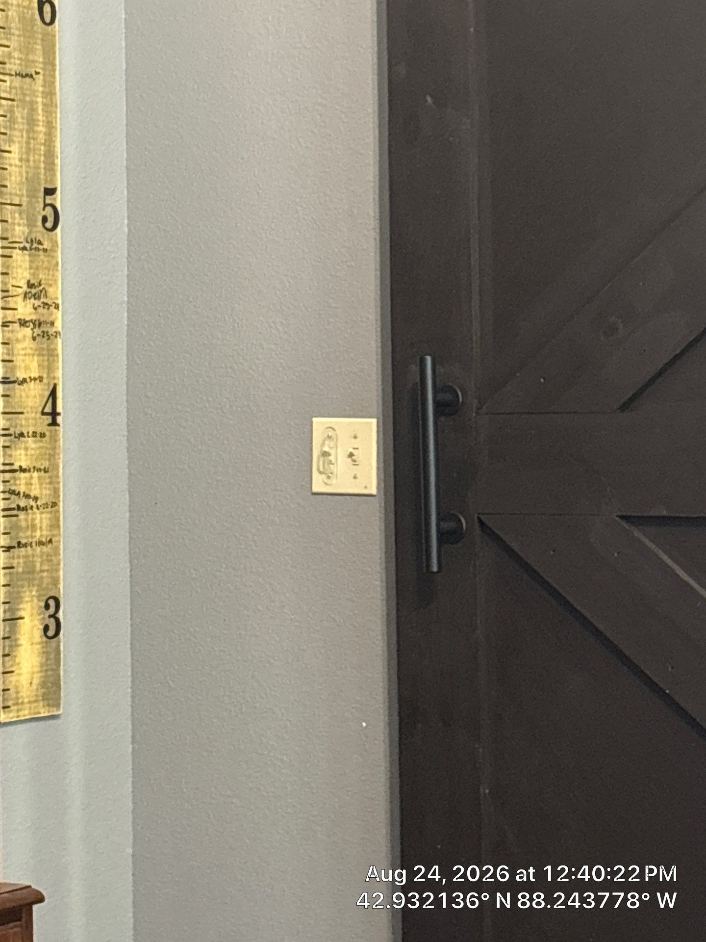 Dark Stained Sliding Barn Door Installation in Waukesha by CompanyCam Sales Demo