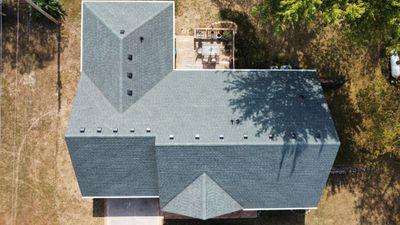 Residential Roofing Install - Green Atlas Pinnacle Pristine Shingles - White Gutters & Downspouts 