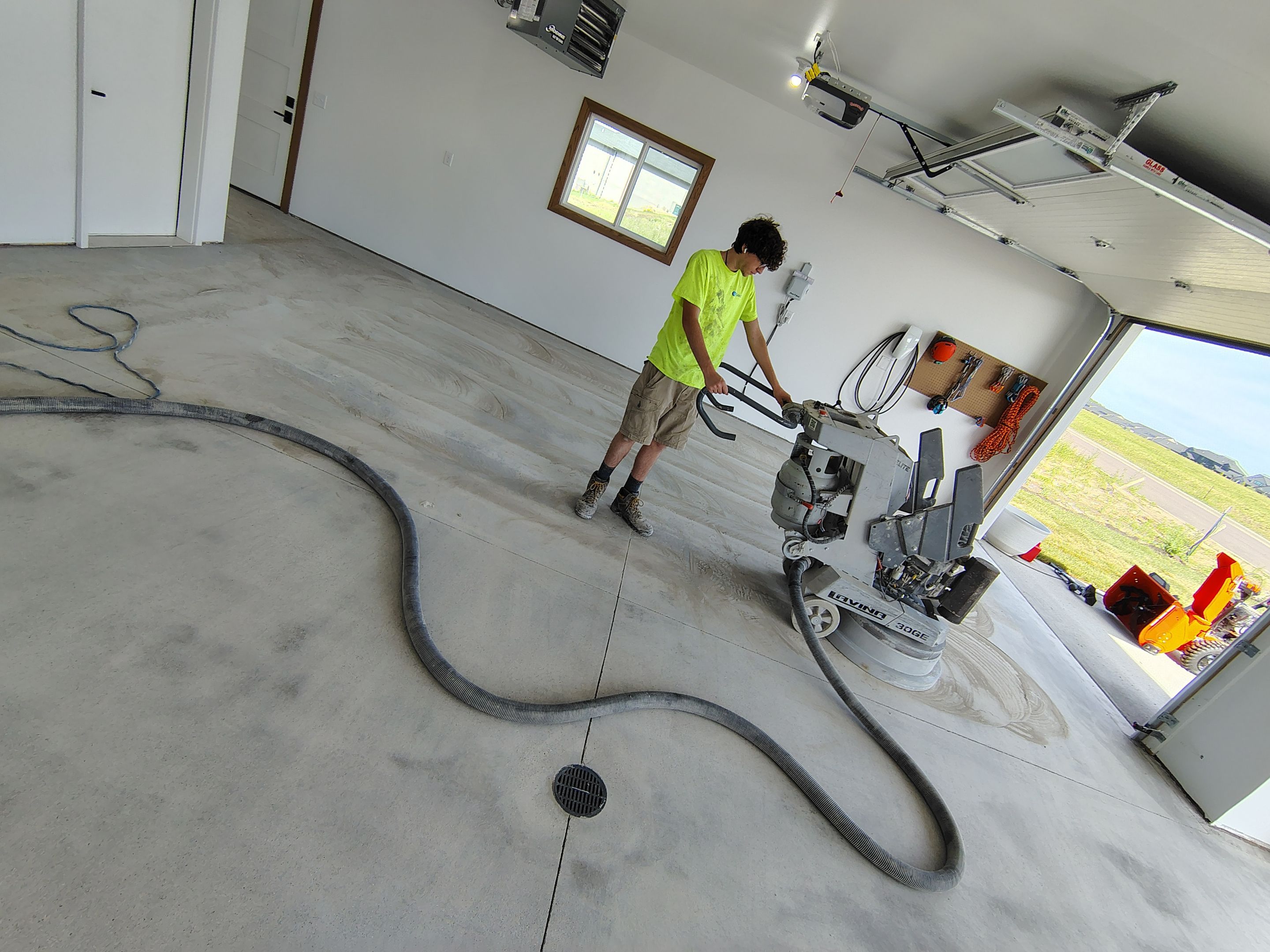 Gray and White Speckled Epoxy Garage Floor Coating in Tea by Select Painting, Coatings & Garage Cabinets