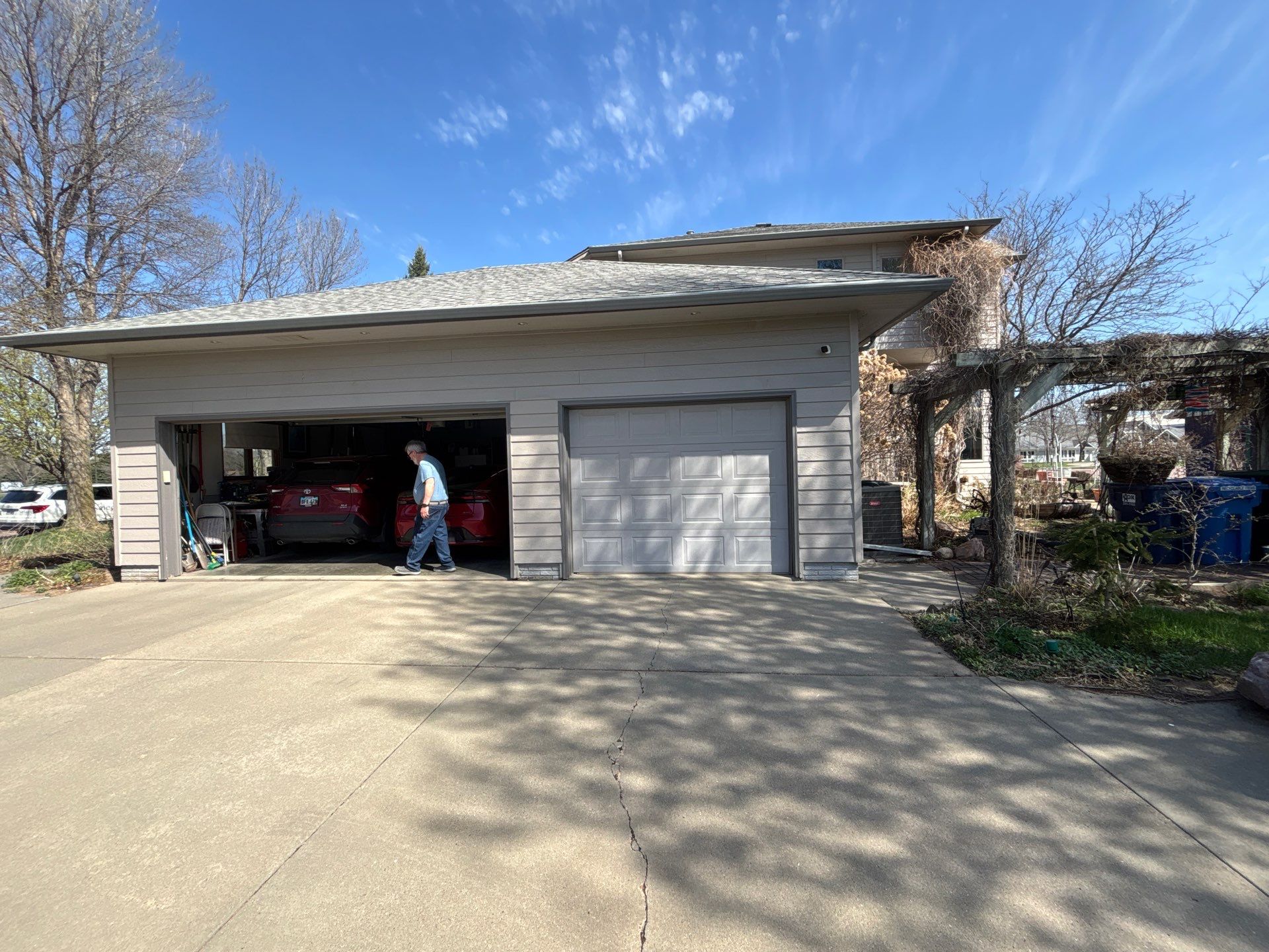 Exterior Siding and Trim Painting for Sioux Falls Residence by Select Painting, Coatings & Garage Cabinets