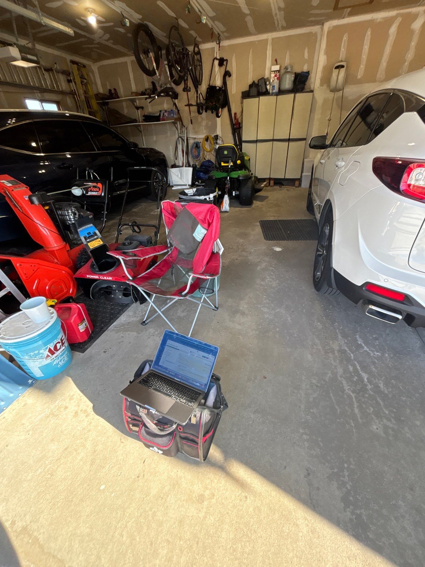 Sioux Falls Garage Concrete Repair and Epoxy Flake Floor Coating by Select Painting, Coatings & Garage Cabinets