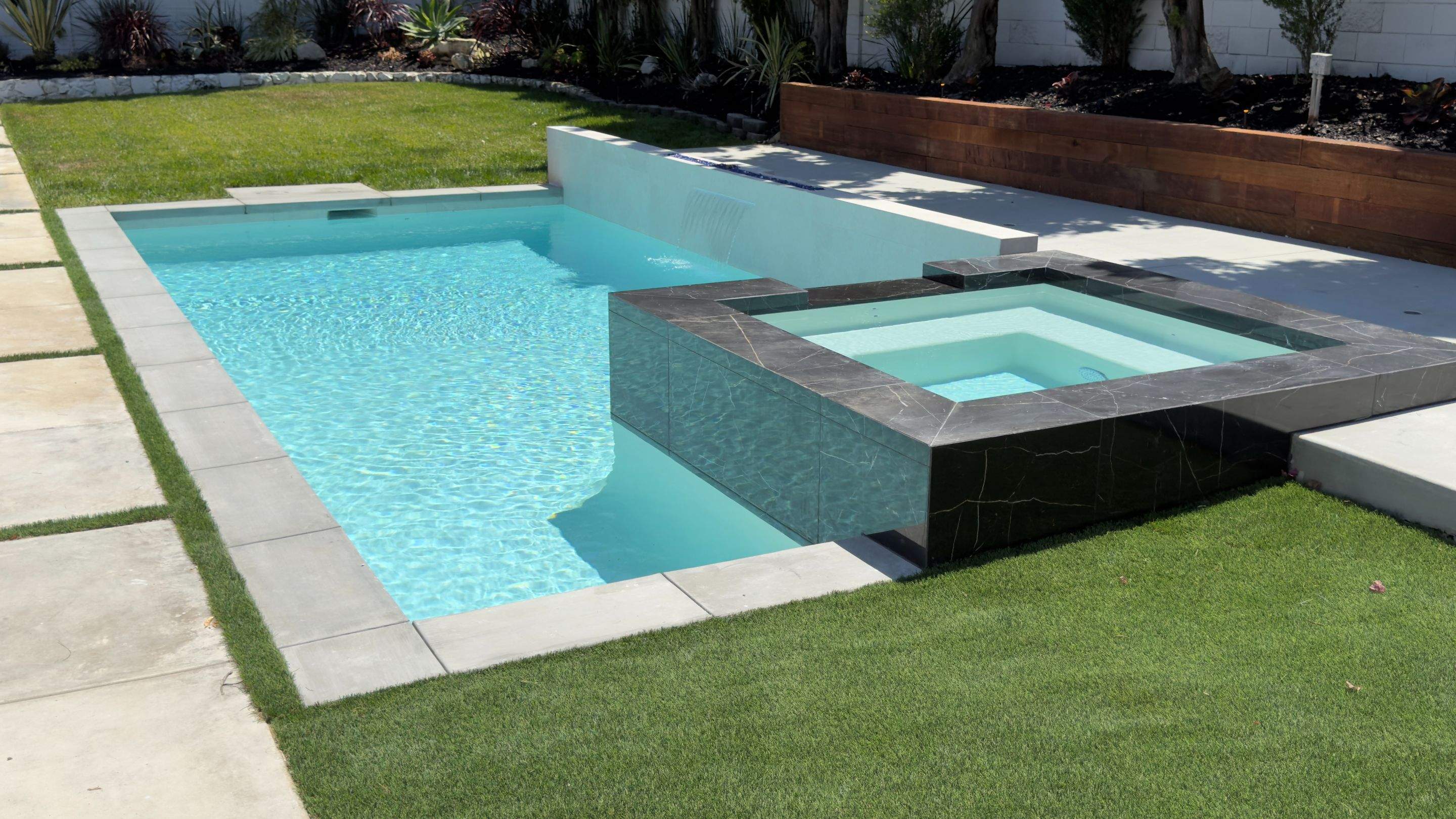 Pool With Raised Spa, Water/Fire Feature by Lax Home Inc 