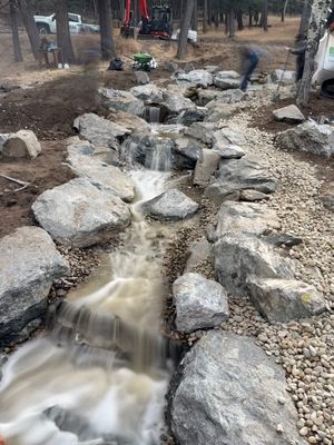 large waterfall and deck