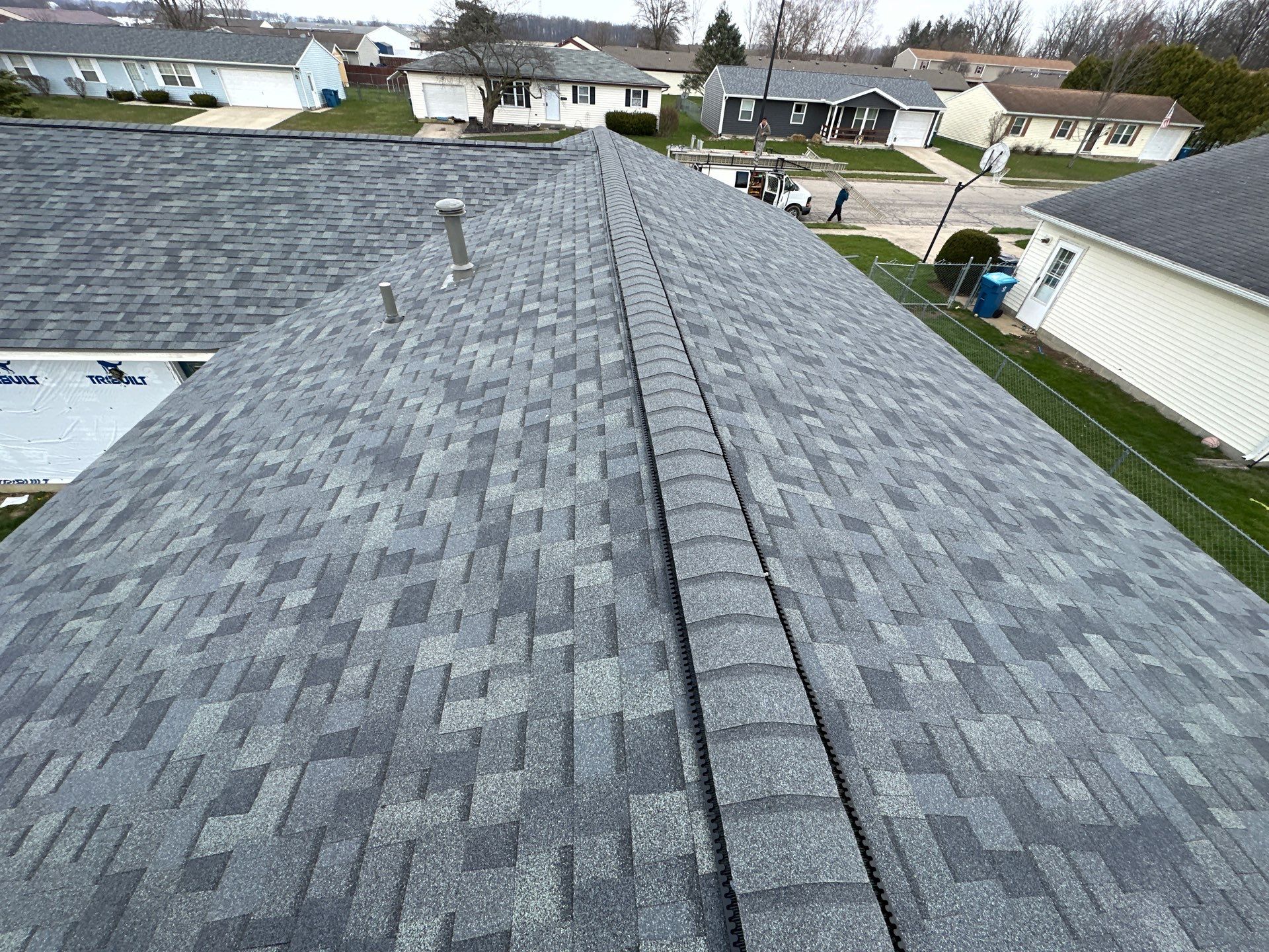 Storm Damage Residential Roof and Siding Installation by WIW Enterprises Inc