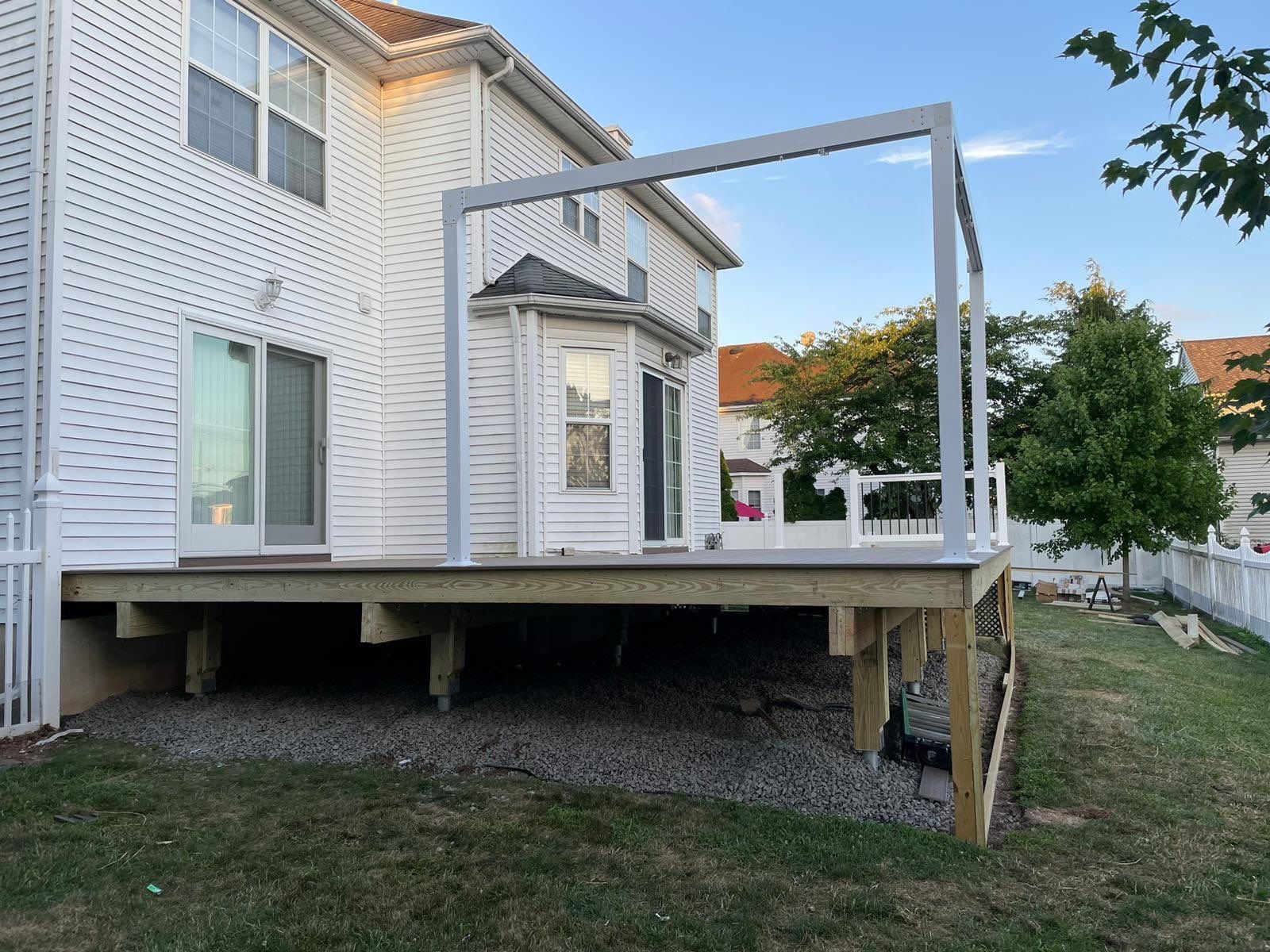 New Deck with Pergola and Vinyl Lattice by deck guardian