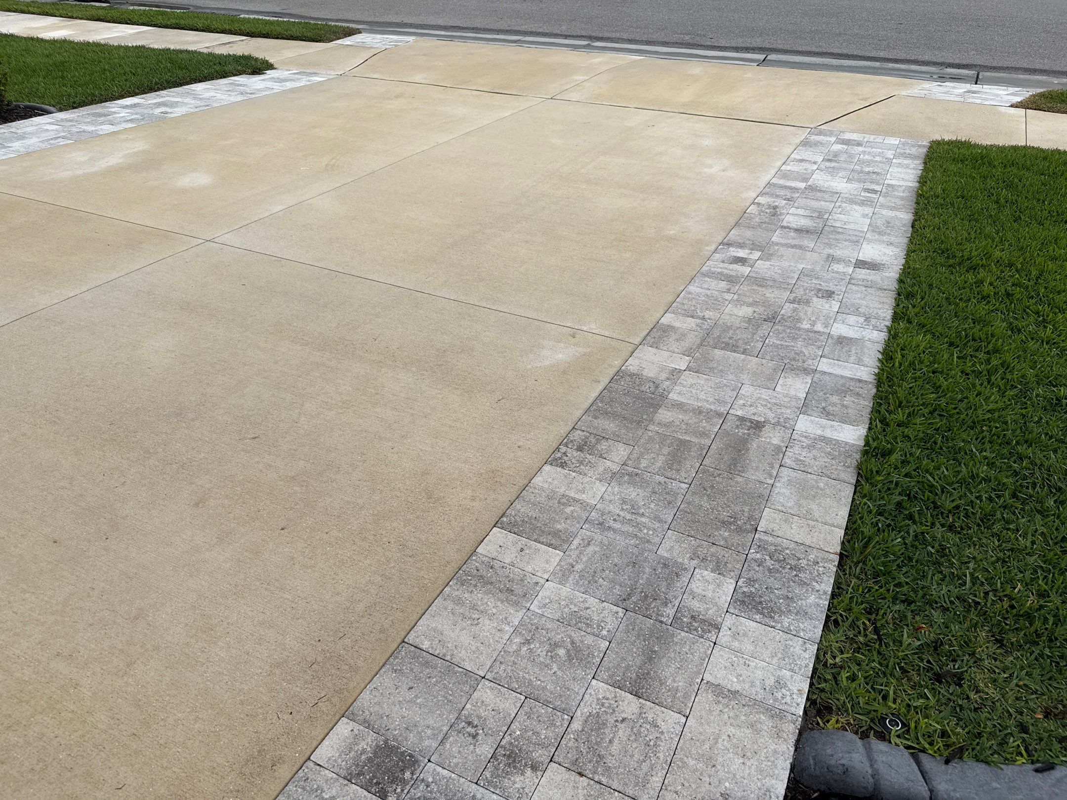 Rust Stain Removal from Concrete Driveway and Pavers in Park East at Azario | Lakewood Ranch, FL by Sunshine AquaWash